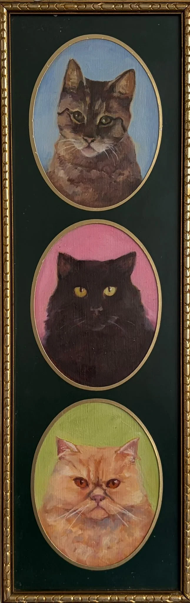 Three painted portraits of cats, each in an oval frame with different colored backgrounds: the top with a tabby cat on a blue background, the middle with a black cat on a pink background, and the bottom with an orange cat on a green background. The f