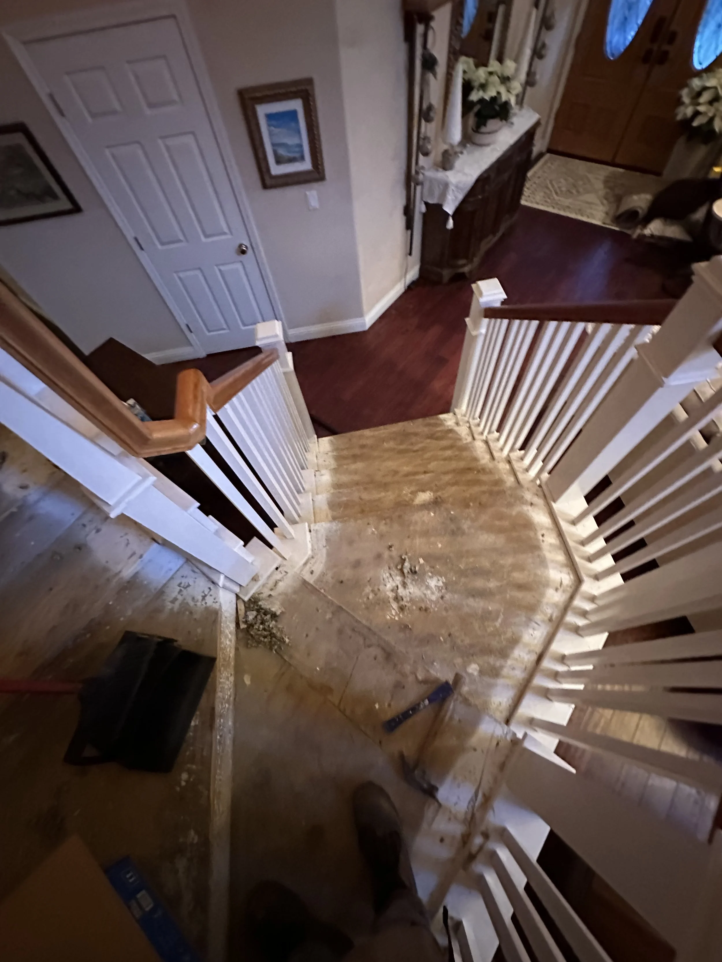 Carpet and padding removed down to the subfloor
