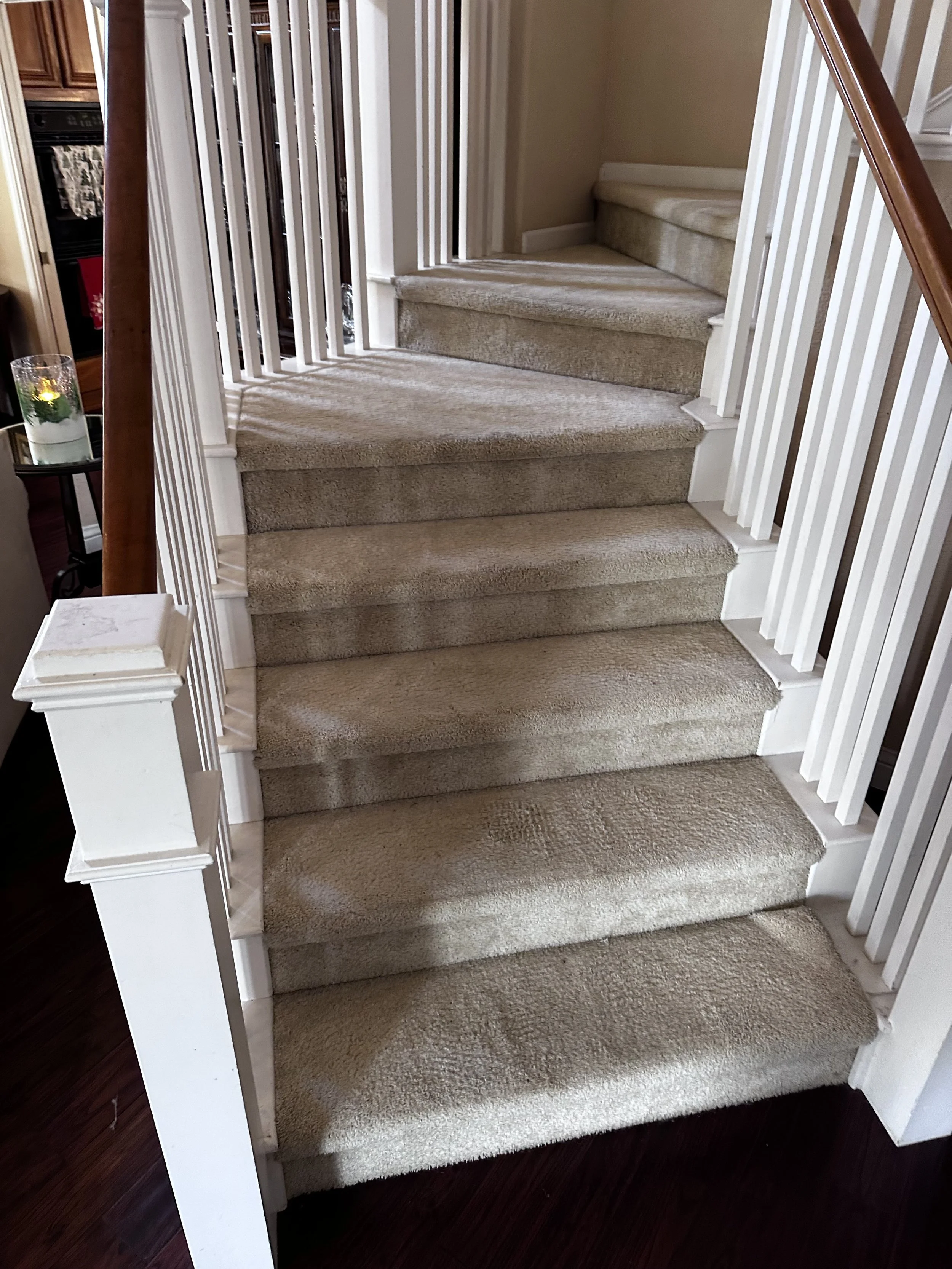 The original carpeted staircase before renovation.