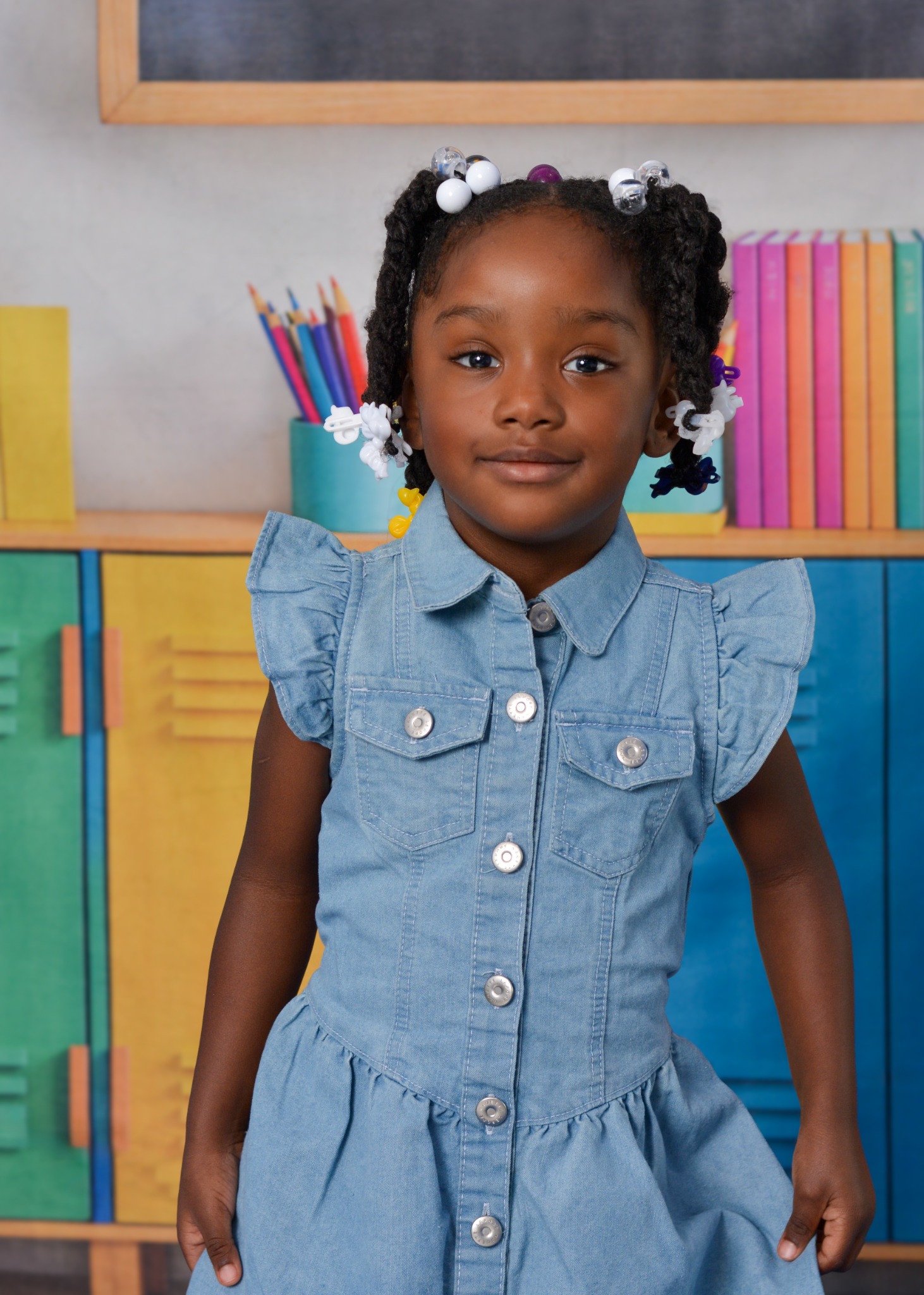 School portrait against a colorful classroom backdrop.