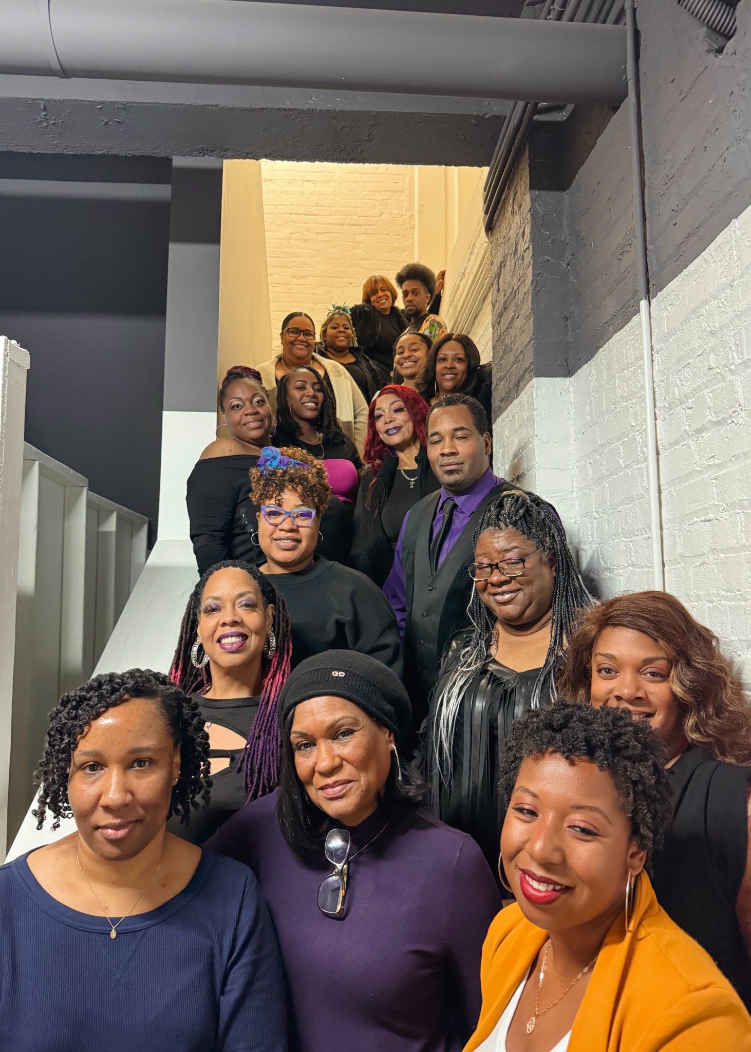 Group portrait on a staircase at the De Barker IDWD event.