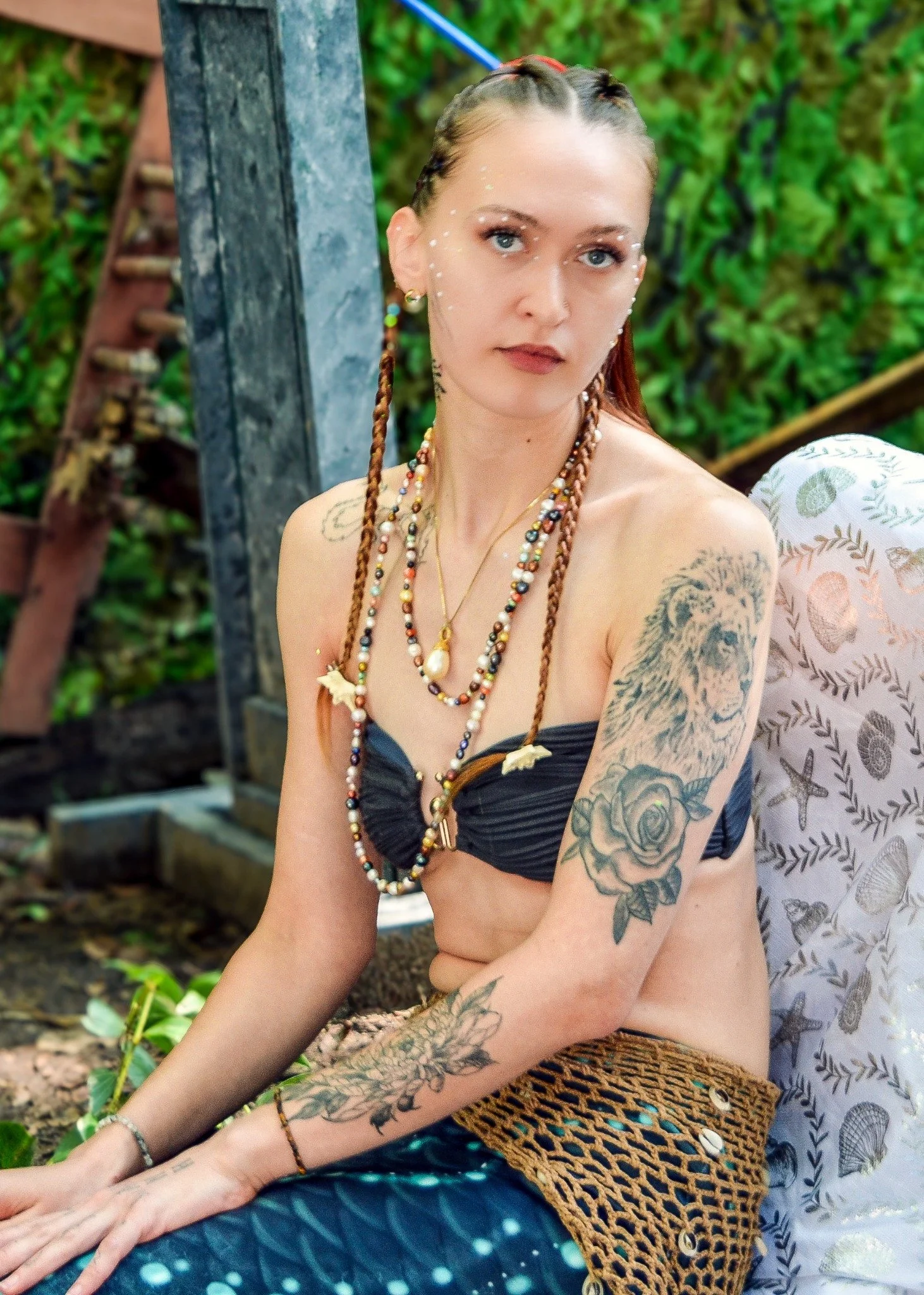 Seated client portrait in costume during a portrait session at a Renaissance festival.