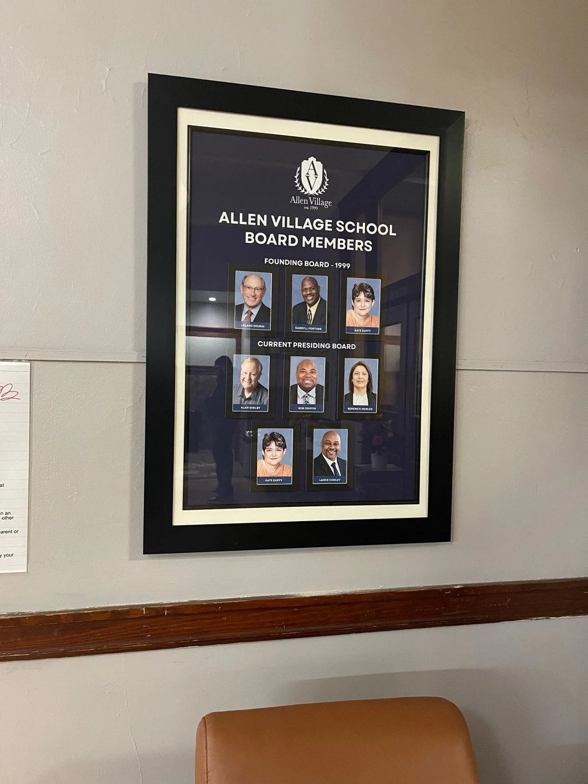 Framed Allen Village School board member display installed on a wall