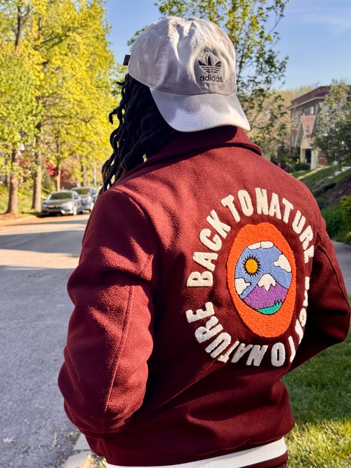 Burgundy jacket detail photographed from behind.