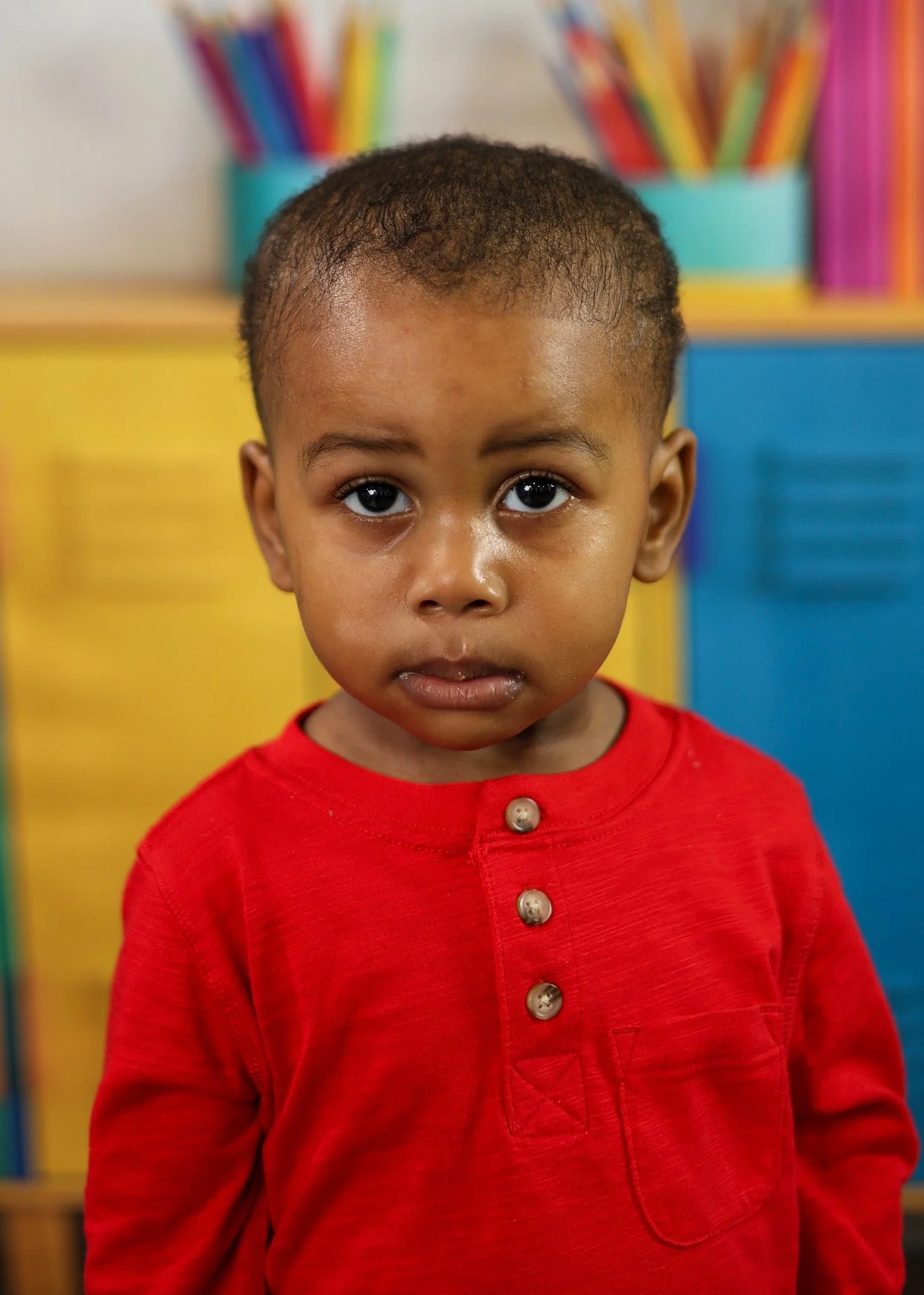 School portrait with a colorful classroom setting.