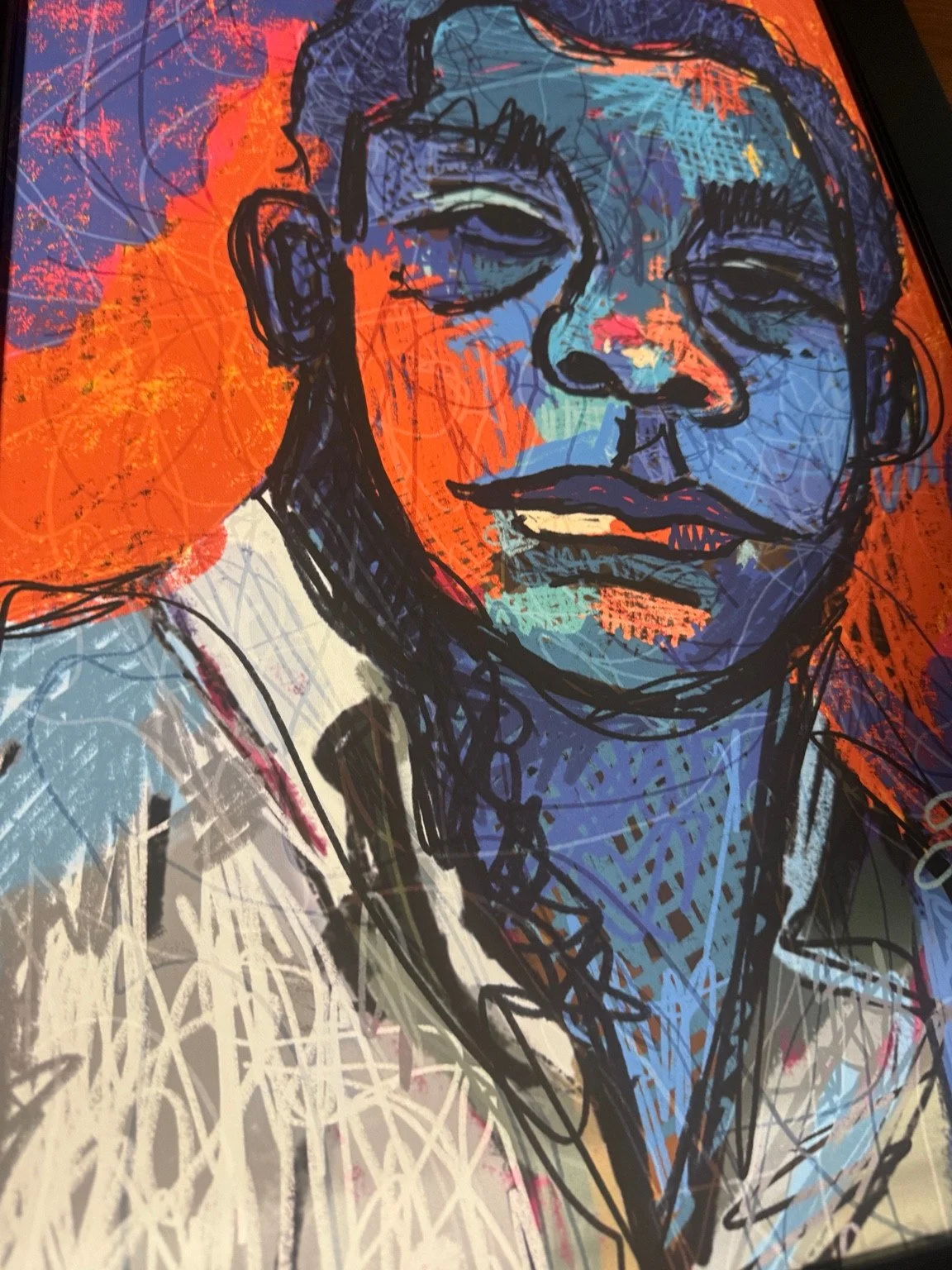 Expressive portrait artwork in orange and blue by Jasmine Ali.