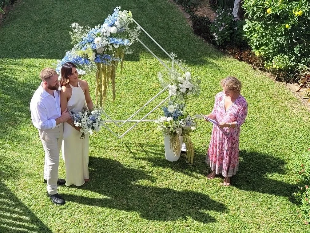 Spring garden wedding celebrant speech next to couple