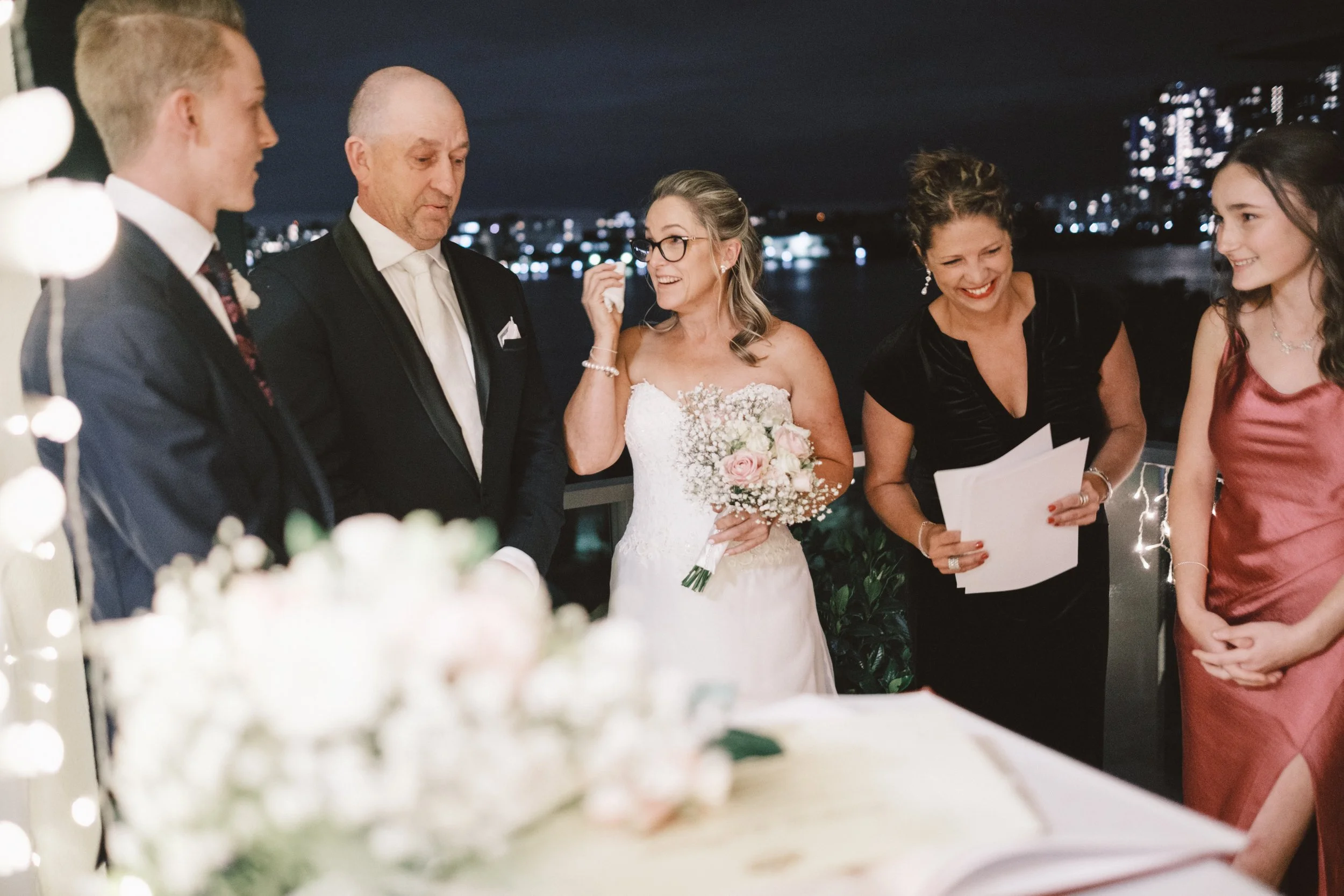 Sydney marriage celebrant Kate Cohen conducting a surprise wedding ceremony at a 50th birthday party in Sydney's Inner West