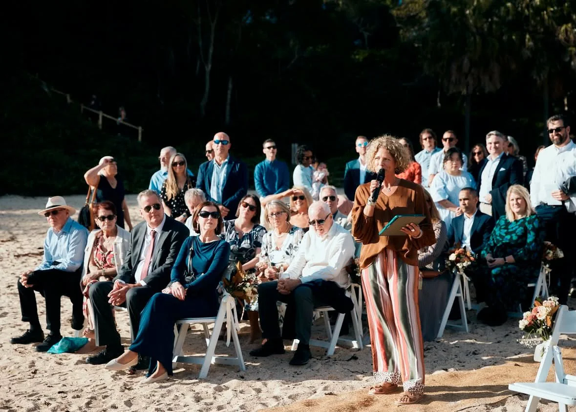 Wedding celebrant Kate Cohen conducting a beach wedding