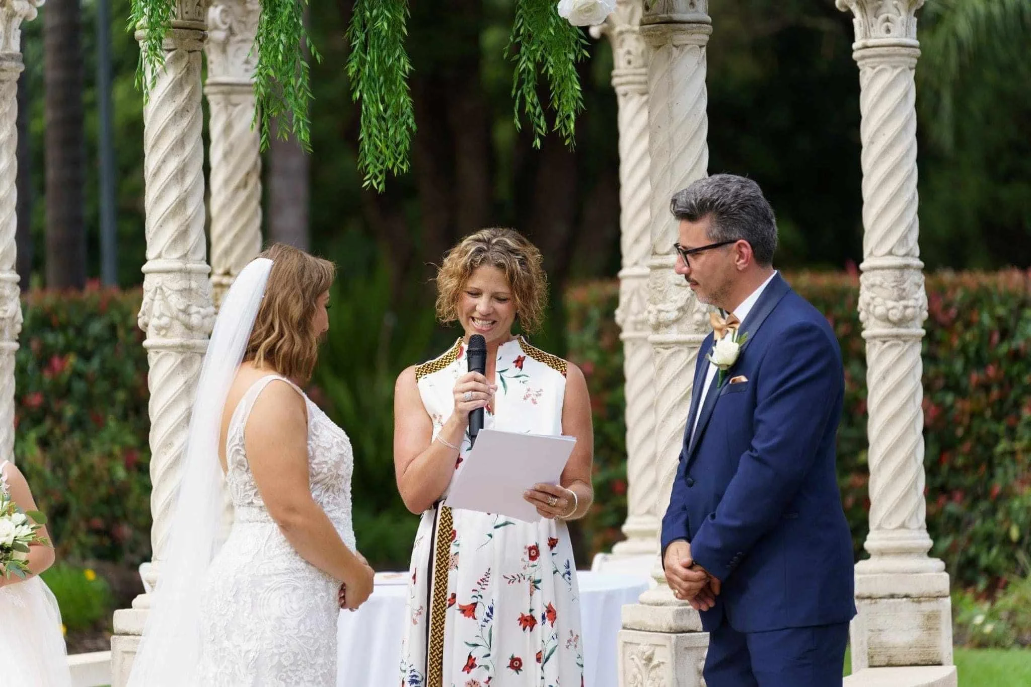 Marriage celebrant Kate Cohen with the Bride and groom at alter in garden wedding in Sydney