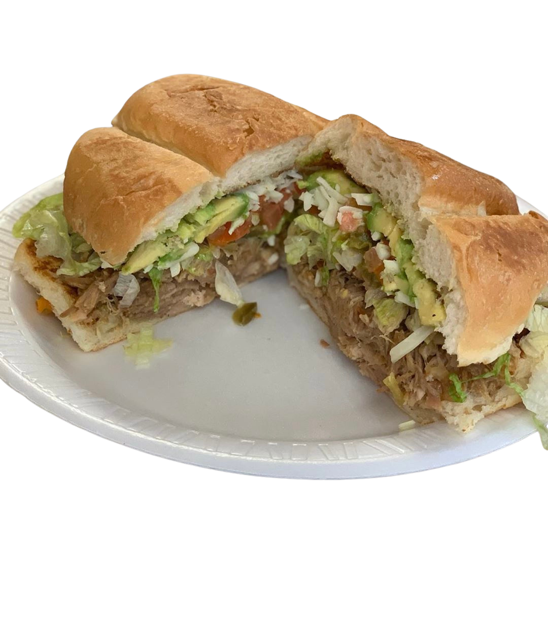 A sandwich on a white paper plate with lettuce, tomato, avocado, and shredded cheese inside a hoagie bun.