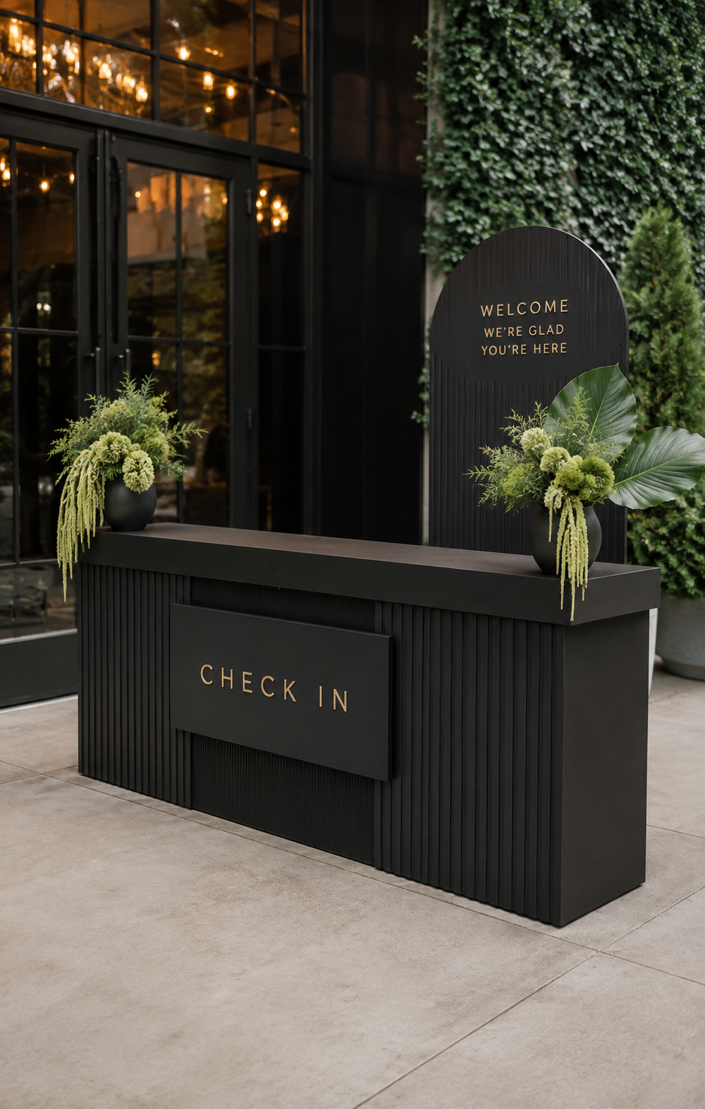 Custom check-in and entry displays featuring handcrafted tables, backdrops, and event structures designed for corporate events, product launches, company celebrations, and venue gatherings.
