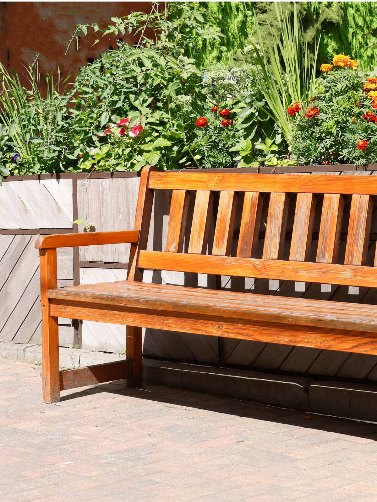 Custom handcrafted reading bench with a handpicked wood stain, designed for a backyard in Chicago.