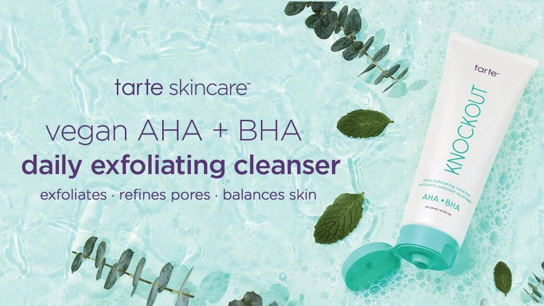 Tarte skincare vegan AHA + BHA daily exfoliating cleanser tube on a water surface with mint leaves and eucalyptus branches.