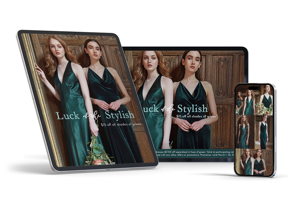 Multiple devices displaying a fashion advertisement for green dresses, featuring two women in emerald green dresses with a wooden background, with promotional text offering a discount.