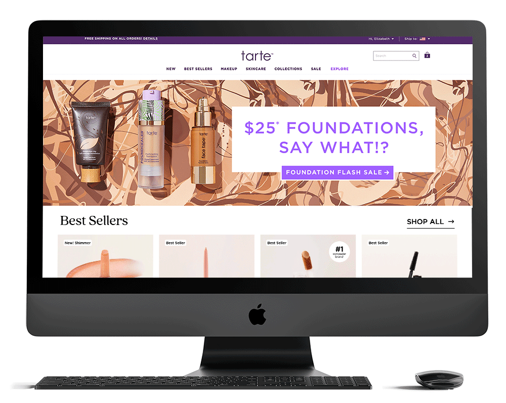 An Apple iMac computer displaying an online beauty store featuring tarte cosmetics, with a woman shopping for foundation and other makeup products.