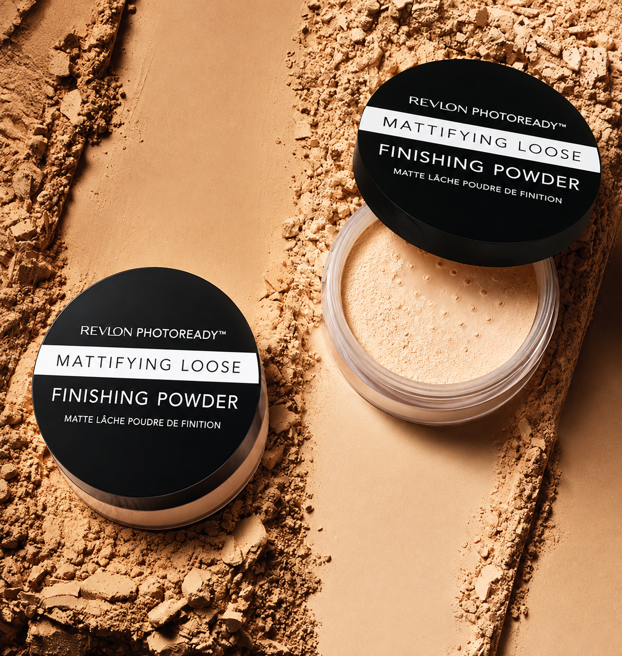 Open container of Revlon Photoready Mattifying Loose Finishing Powder on a beige background, with spilled powder around the container.