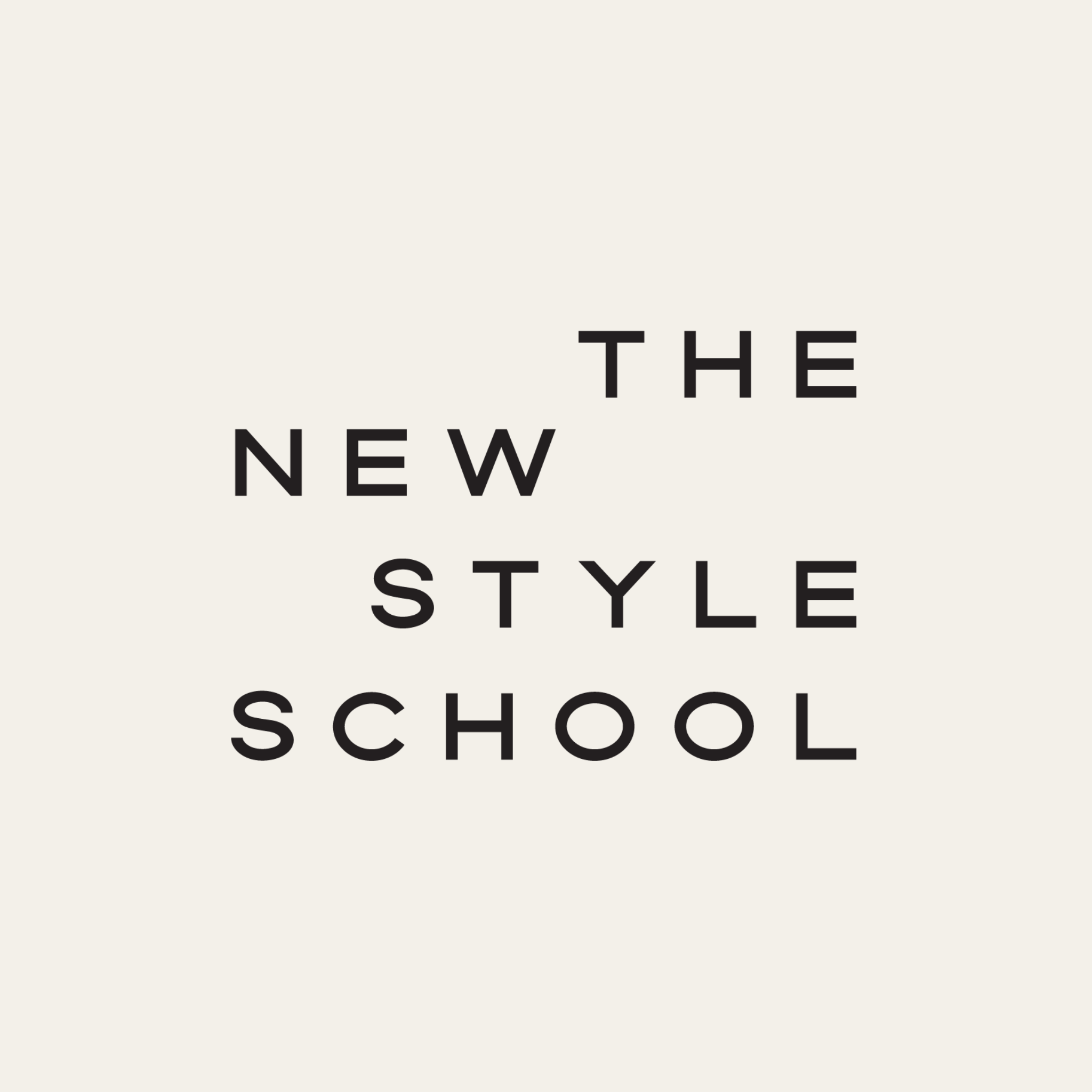 Partial view of a sign with the words 'THE NEW STYLE SCHOOL' in black text on a light background.