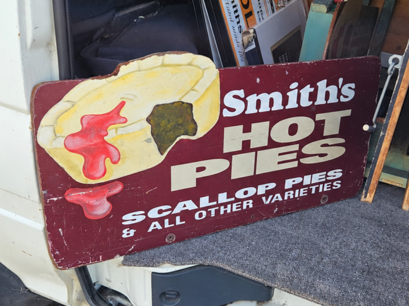 Historic Smith's Hot Pies and scallop pies sign from an earlier era