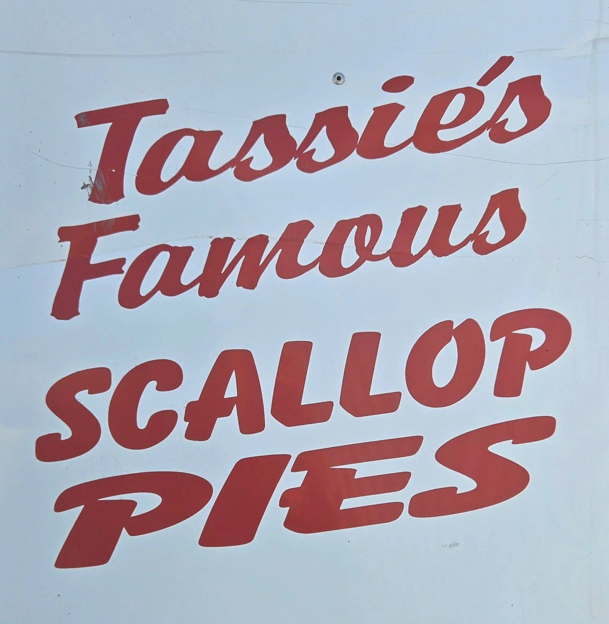Historic Smith's scallop pies sign from an earlier era of the business