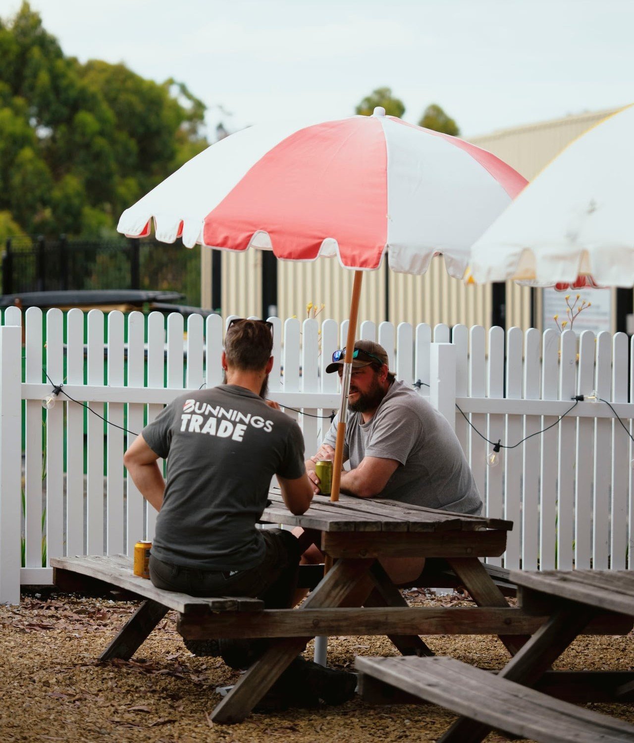 Tradies drinking at outdoor tables at Smith's Pie Yard