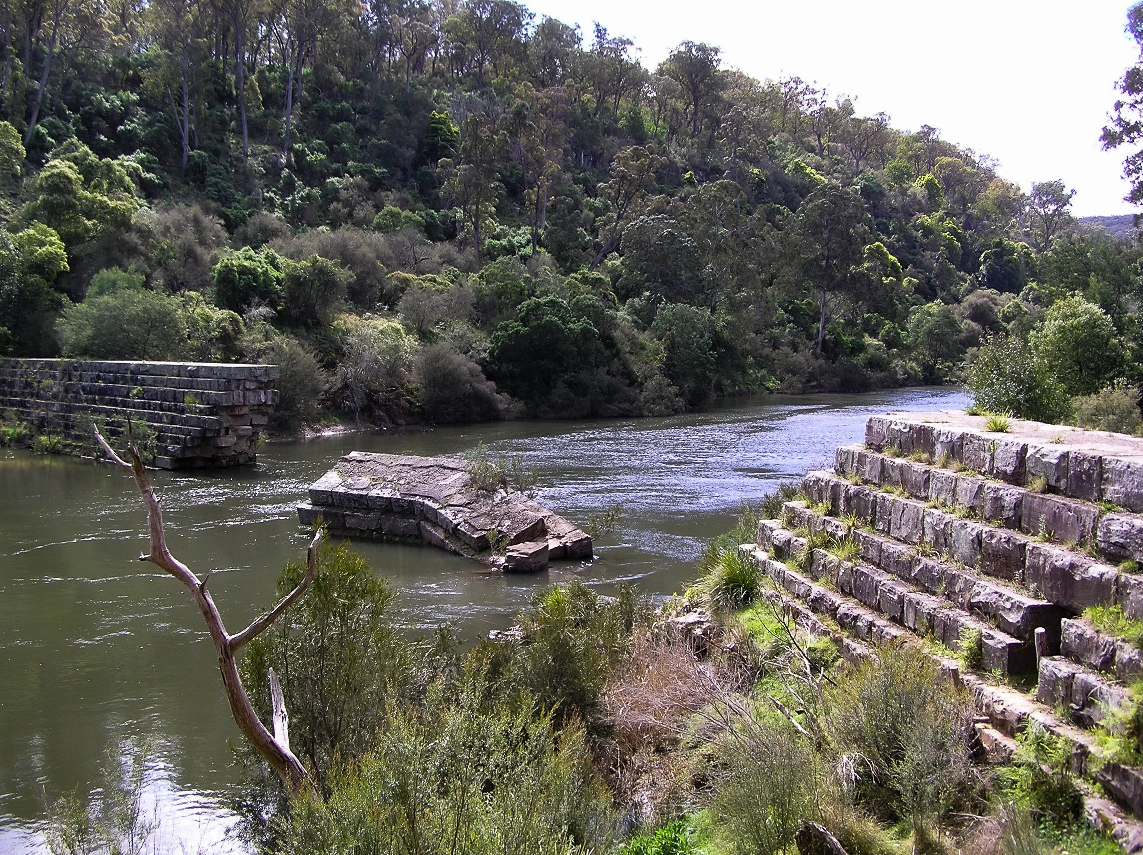 Stone walls and broken masonry of the Glenaladale Weir on the Mitchell River