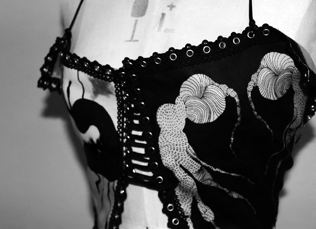 Black face mask with a white seahorse design and decorative elements along the edges.