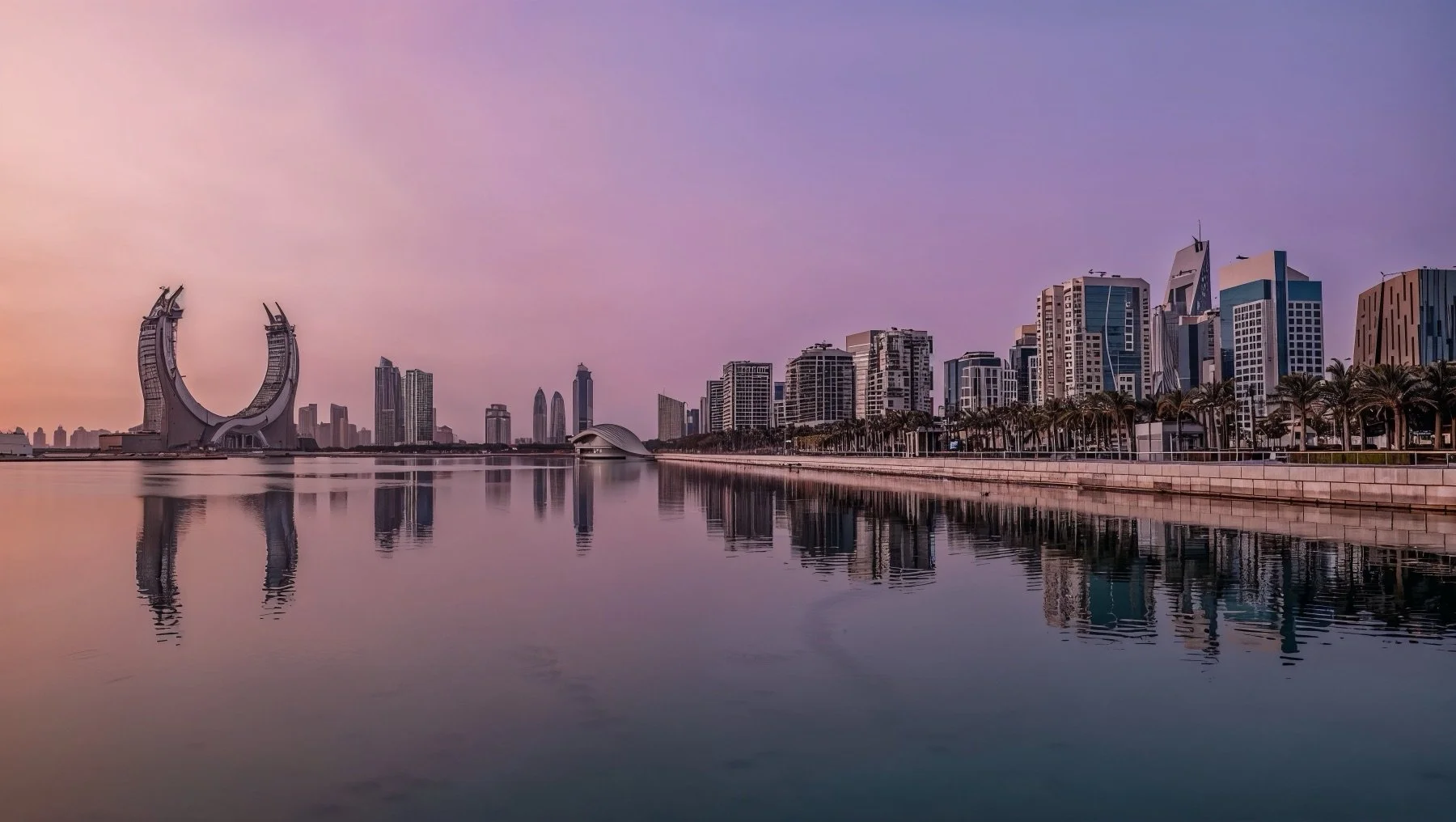 City skyline with modern high-rise buildings along a waterfront during dusk, with their reflections visible in the water and a pastel-colored sky.