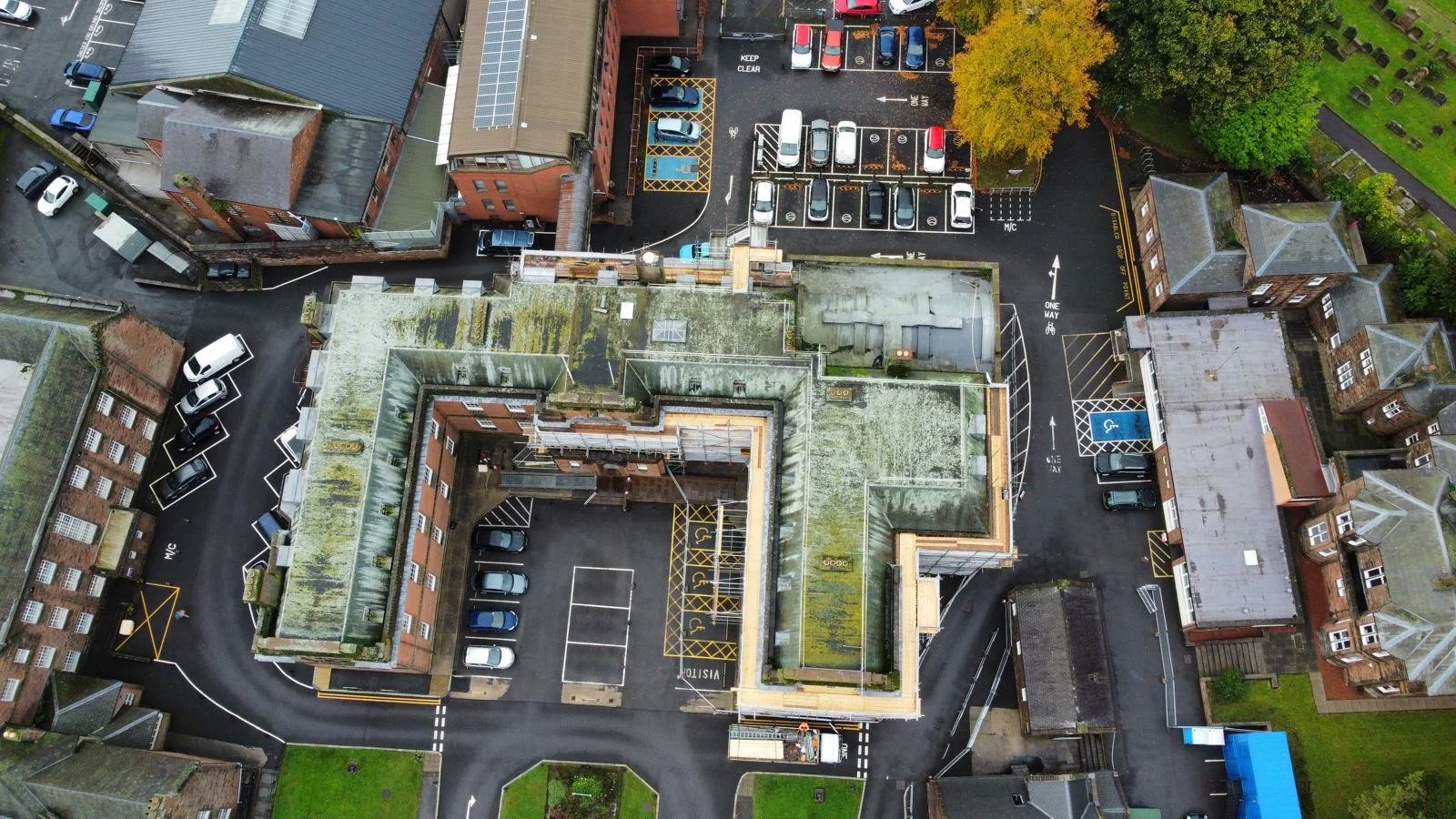 Aerial view showing the full extent of the flat-roof and pitched-roof renewal works.