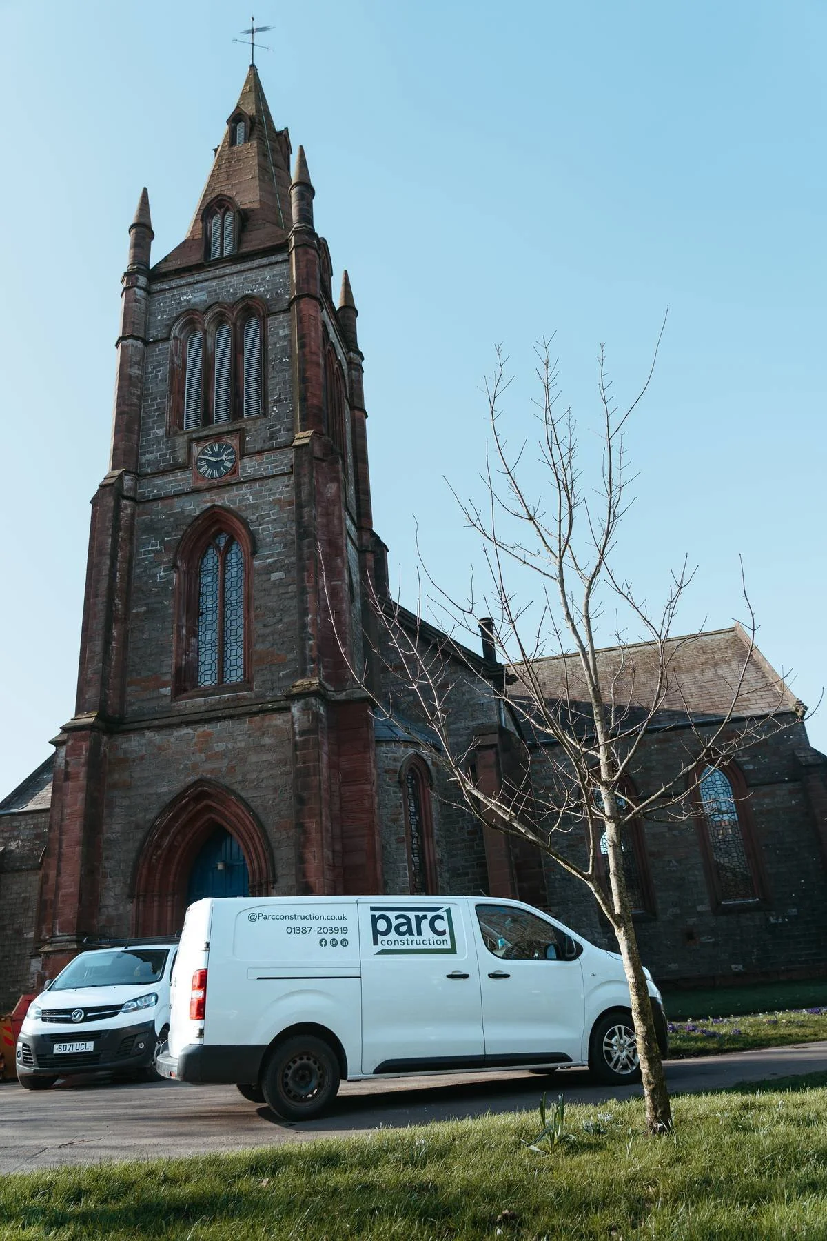 Parc Construction vehicles outside a historic building during construction works in Dumfries and Gallowa