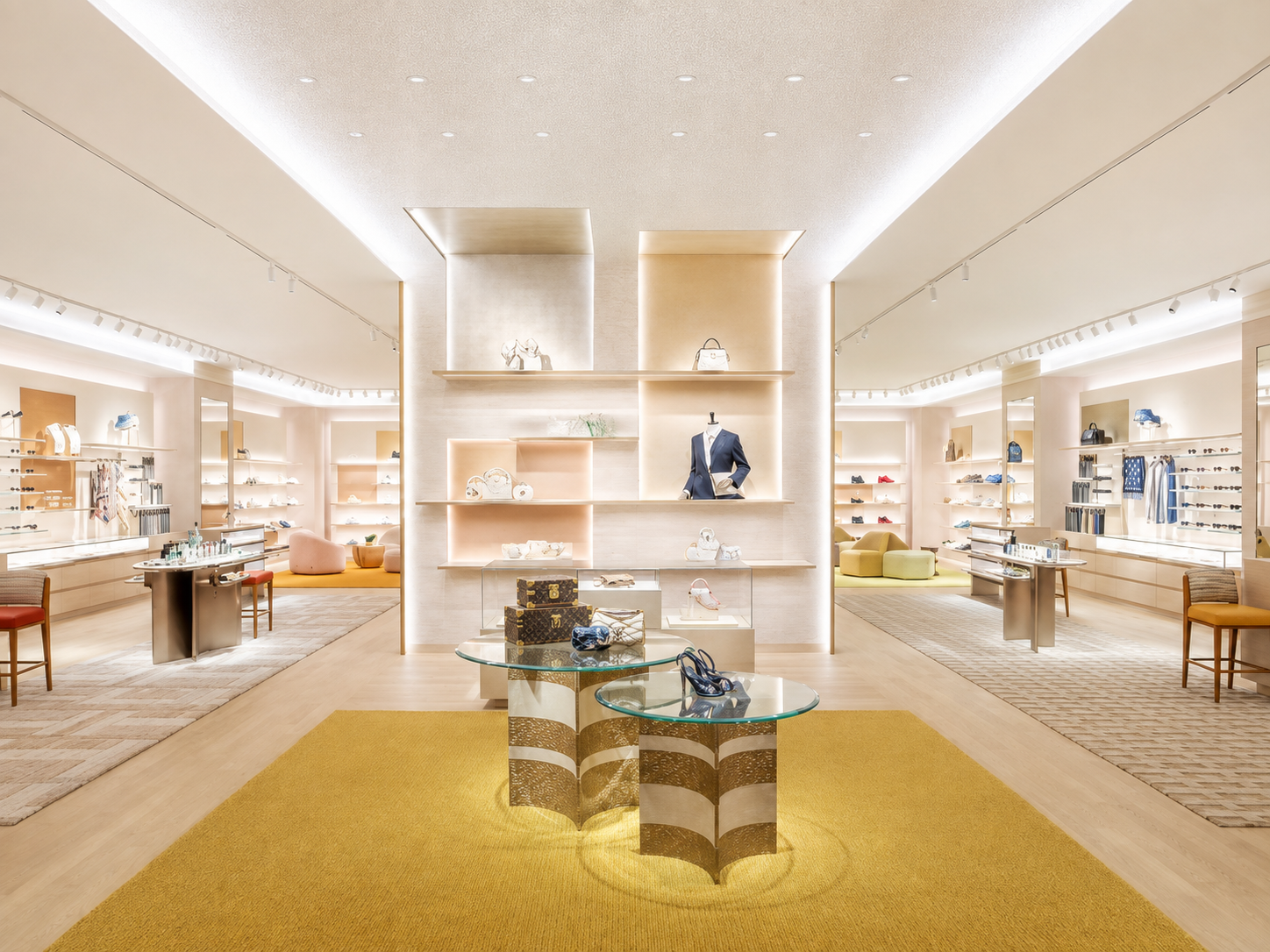 Interior view of a luxury boutique retail store displaying handbags, shoes, and accessories with modern decor and warm lighting.