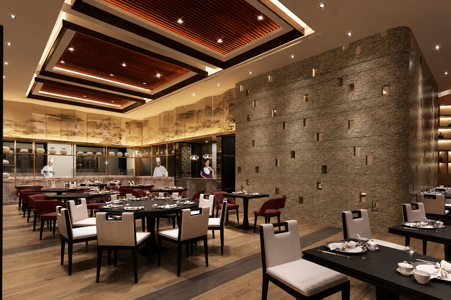 An elegant restaurant interior with wooden flooring, round black tables set with white napkins and dishes, white and maroon chairs, decorative wall art, and chefs in the kitchen area visible through a glass partition.