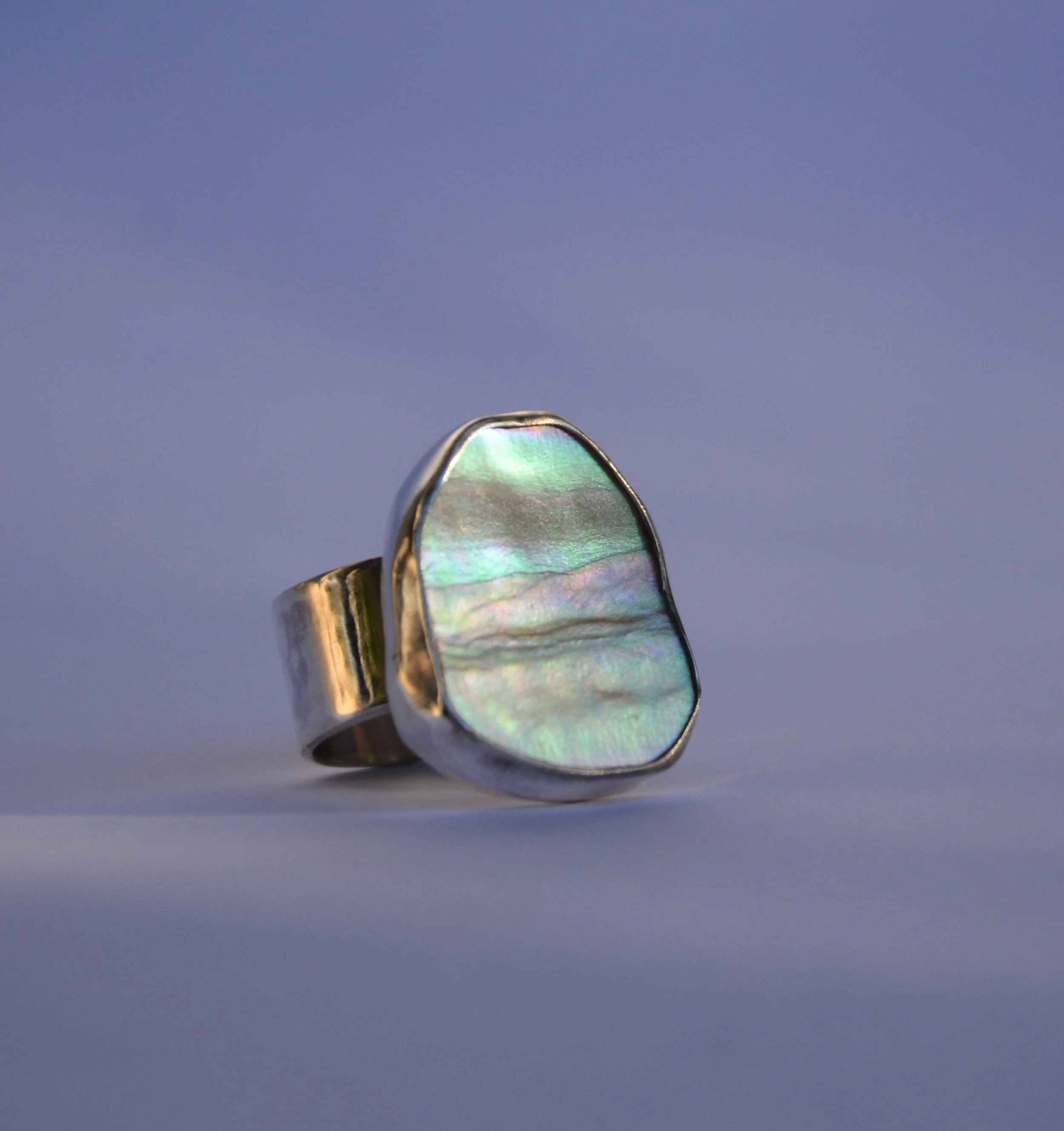 Sterling silver abalone ring with an iridescent sheen