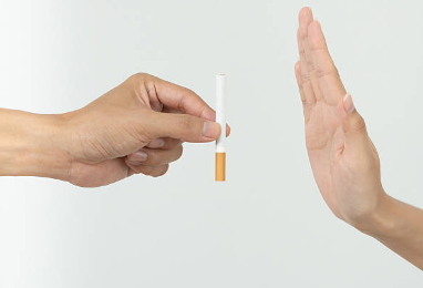 A hand refusing the offer of a cigarette