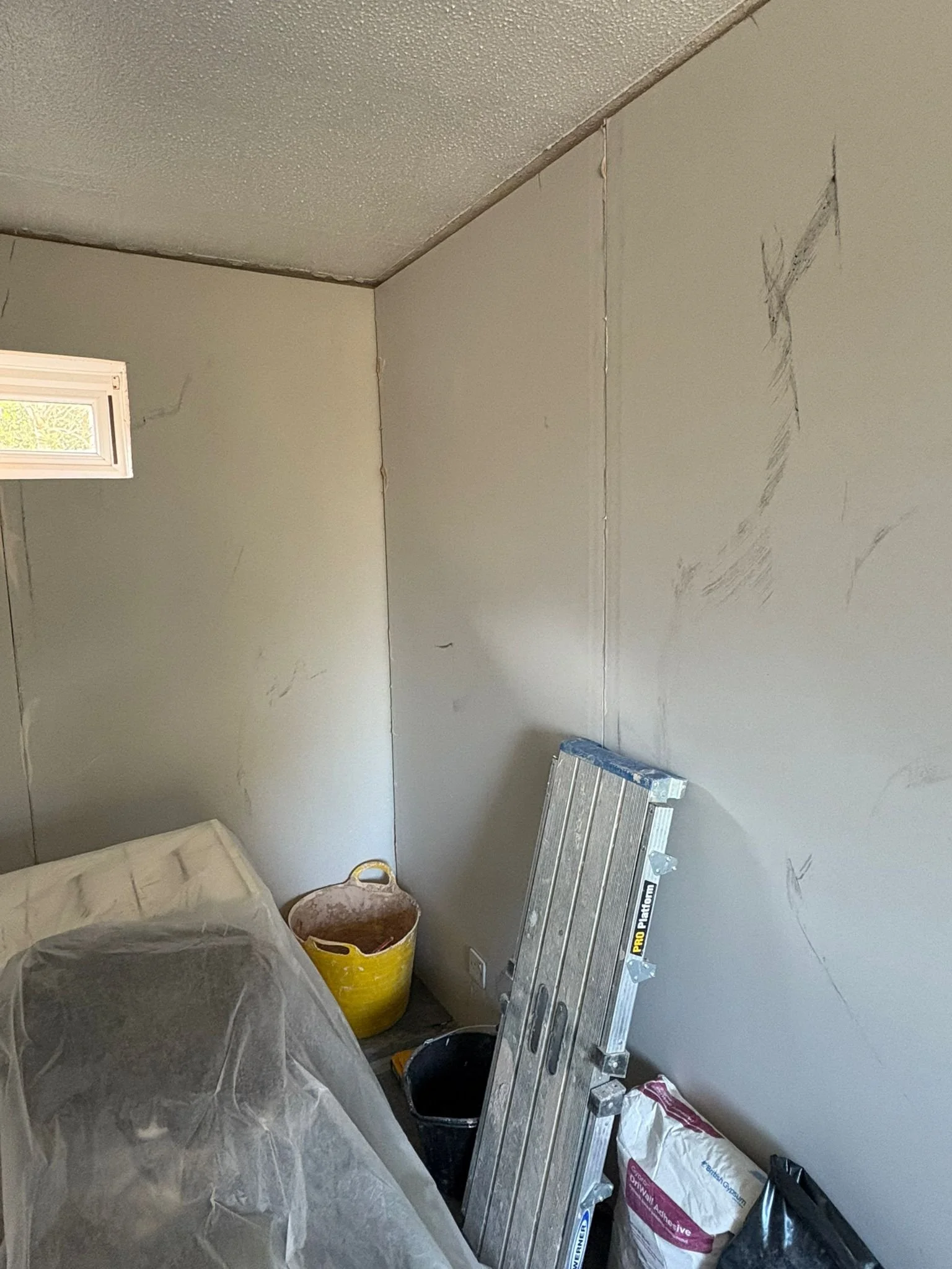 Insulated membrane system installed to the bedroom walls.