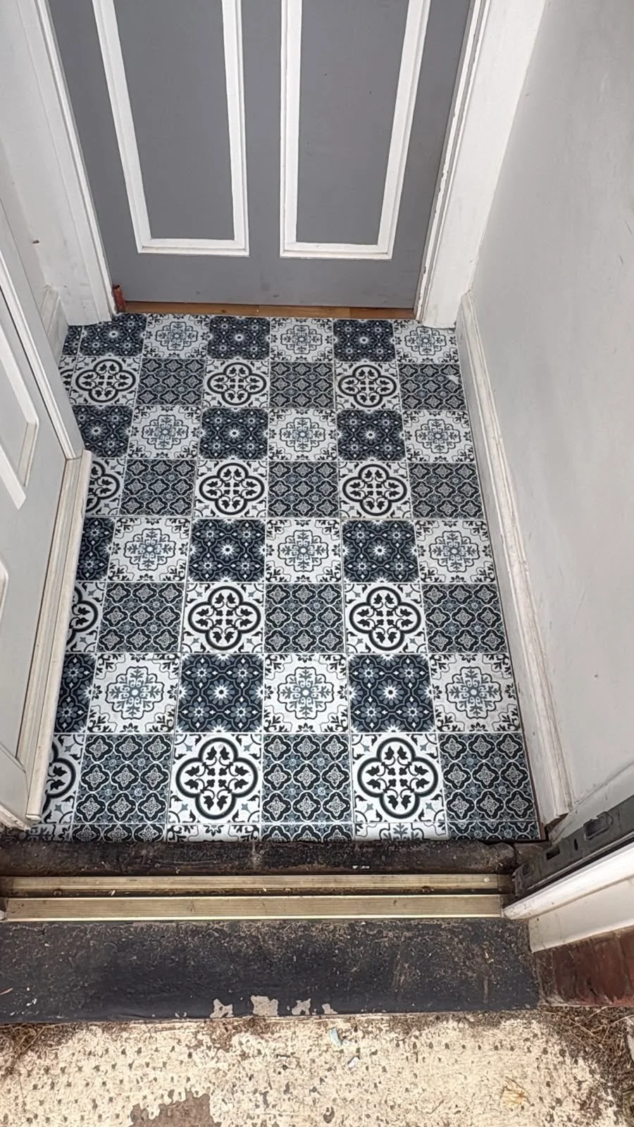 After: newly tiled entrance floor following structural repairs — Bexhill