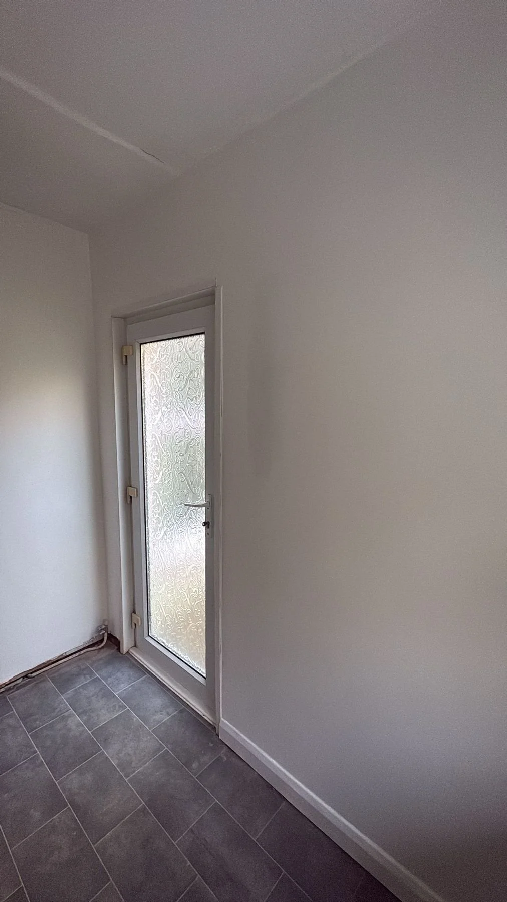 After: completed hallway with tiled floor and fresh finishes — Hastings