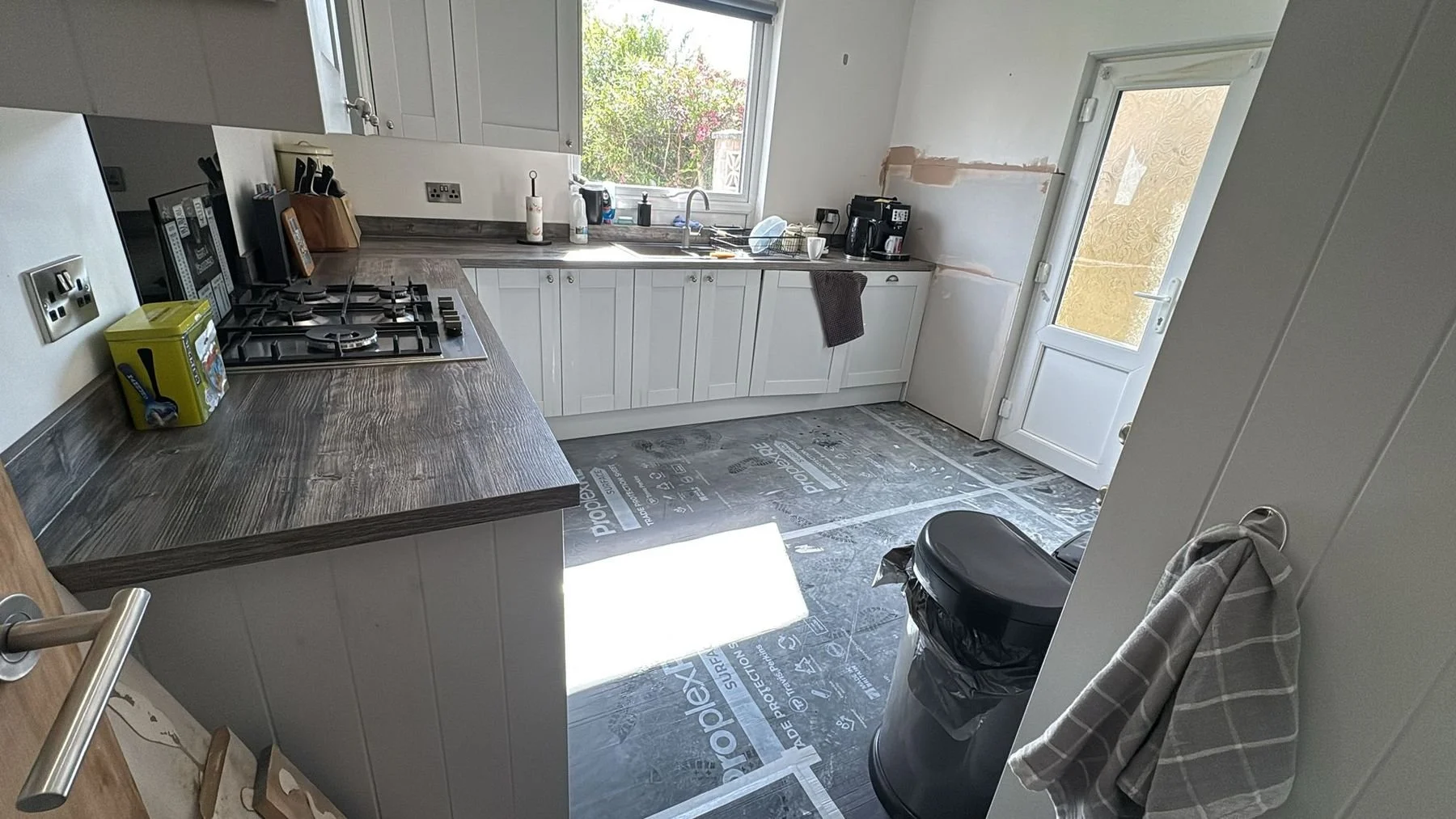 After: kitchen wall replastered following damp treatment — Hastings