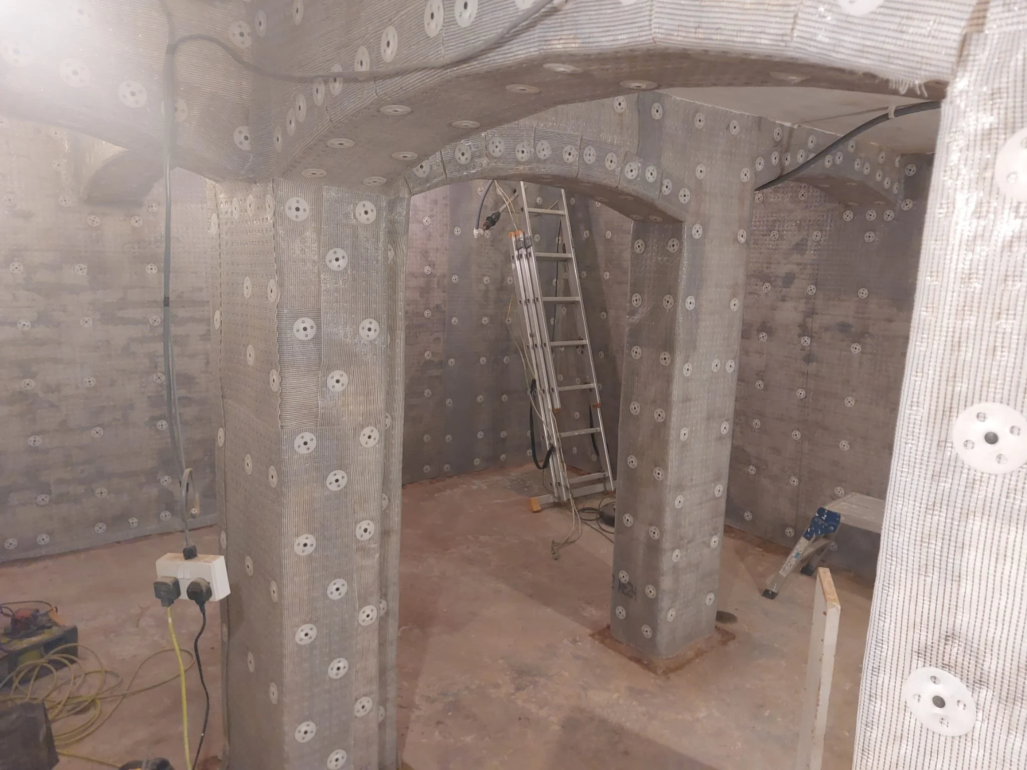 Cavity drainage membrane installed throughout the basement.