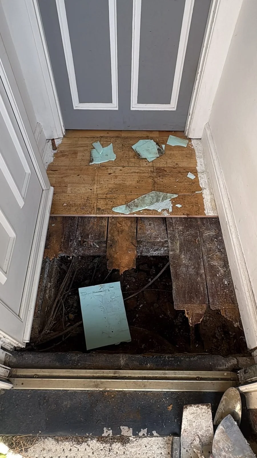 During: floor opened to expose rotted subfloor timbers — Bexhill