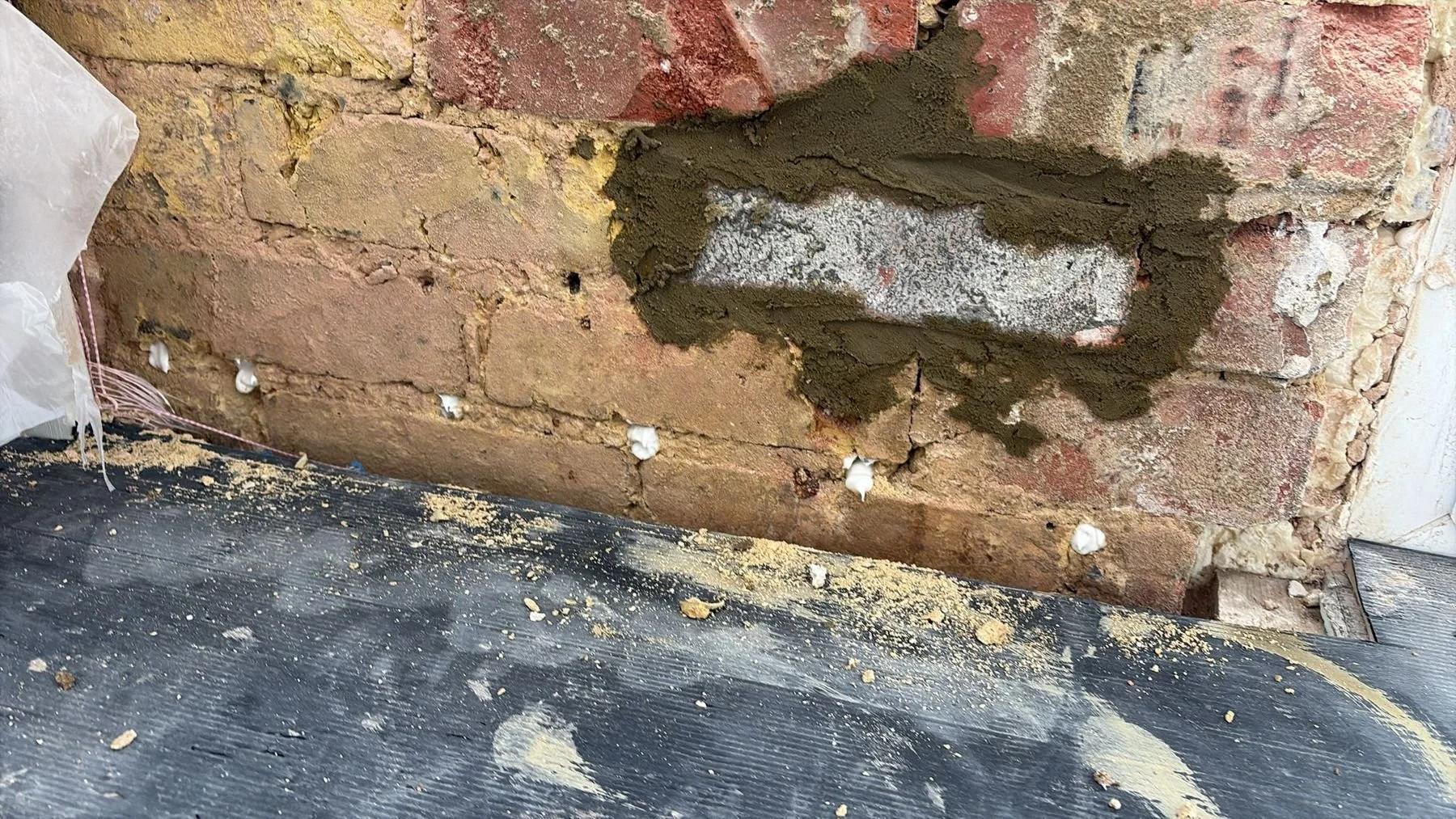 During: chemical DPC cream injection into brick mortar joints — Hastings