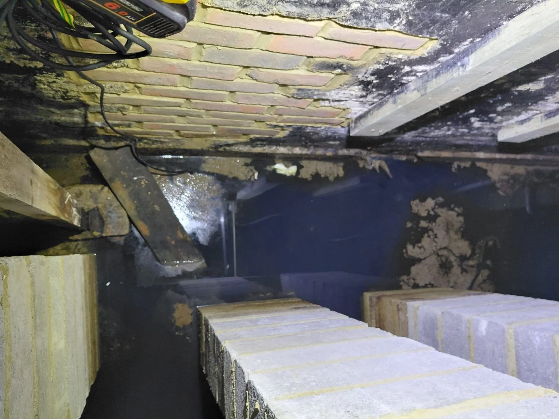 Before: flooded basement crawlspace with standing water — Bexhill