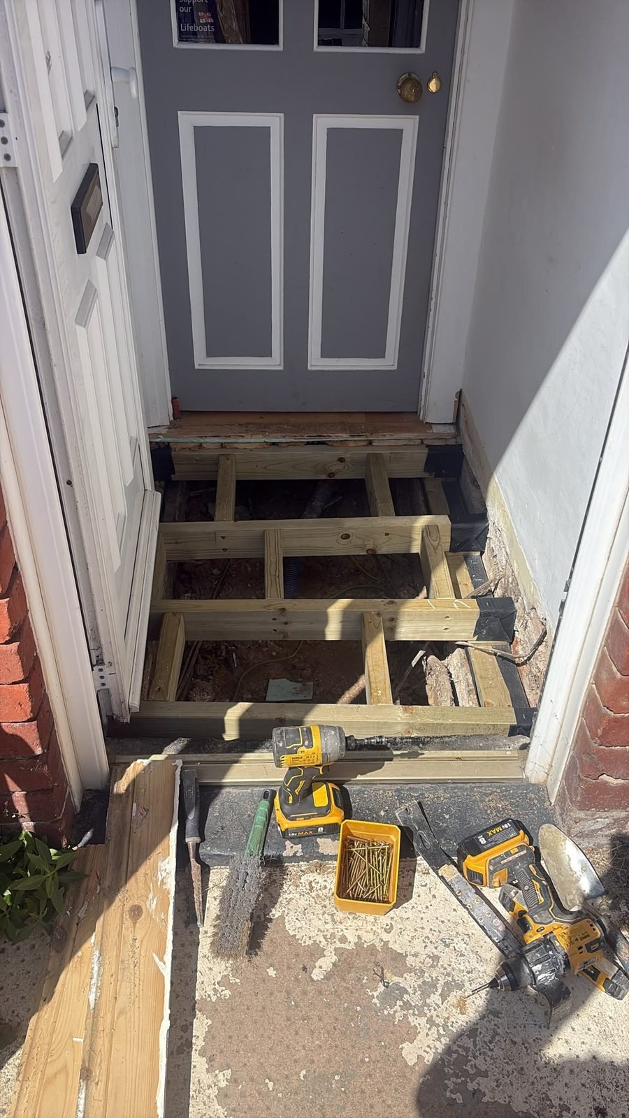 During: new structural floor frame installed after timber replacement — Bexhill