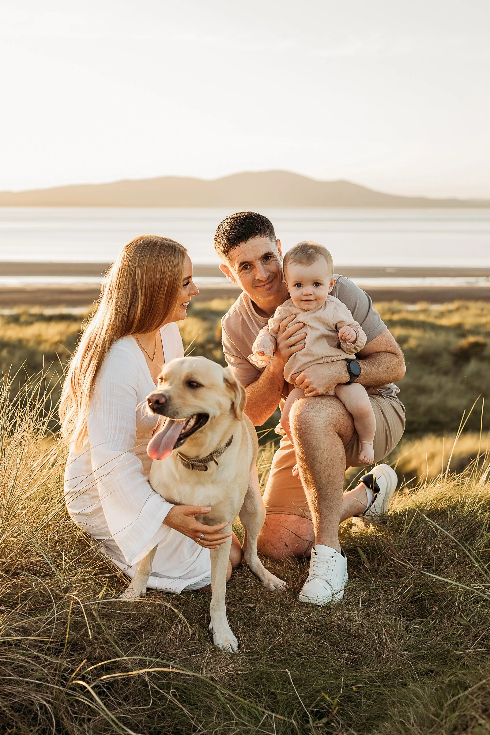 A family enjoying a relaxed outdoor adventure with their dog, capturing the connection, joy and little moments shared together.