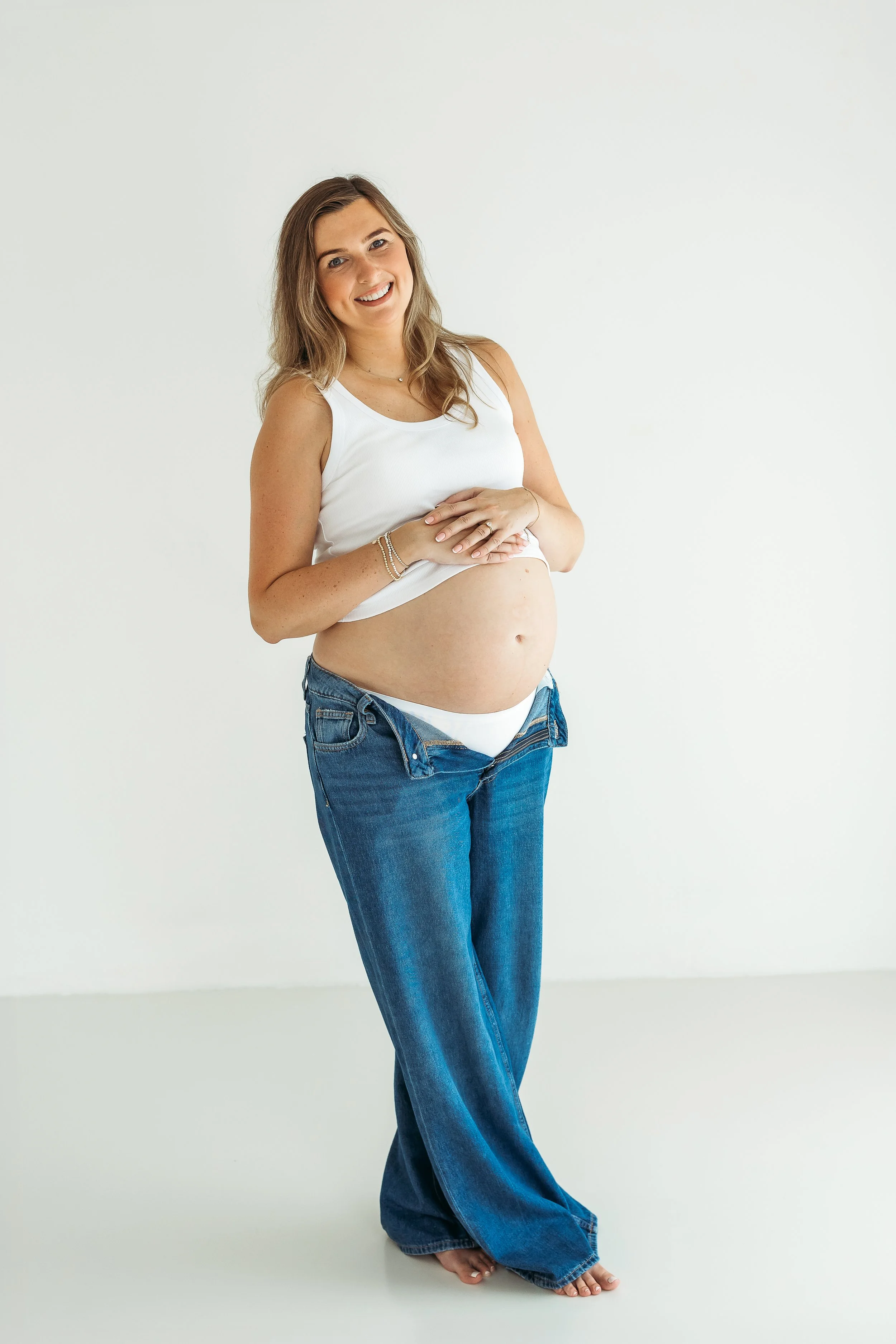 Expectant mother celebrating her pregnancy with a natural maternity photography portrait.