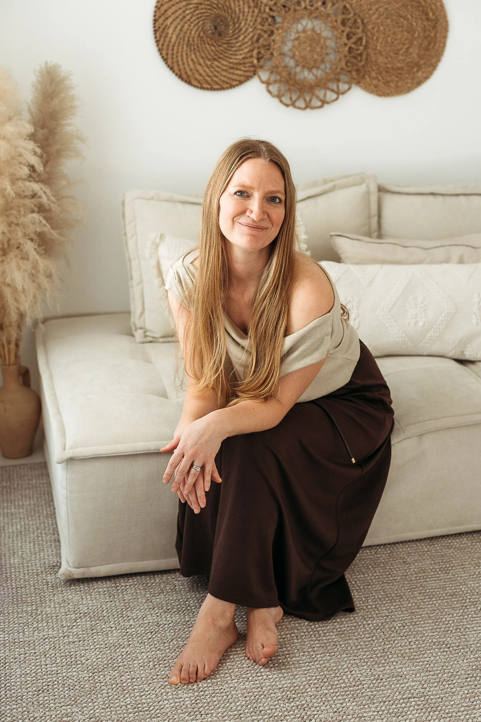 Photographer Ines Henderson sitting in her natural light studio in Silloth, Cumbria.