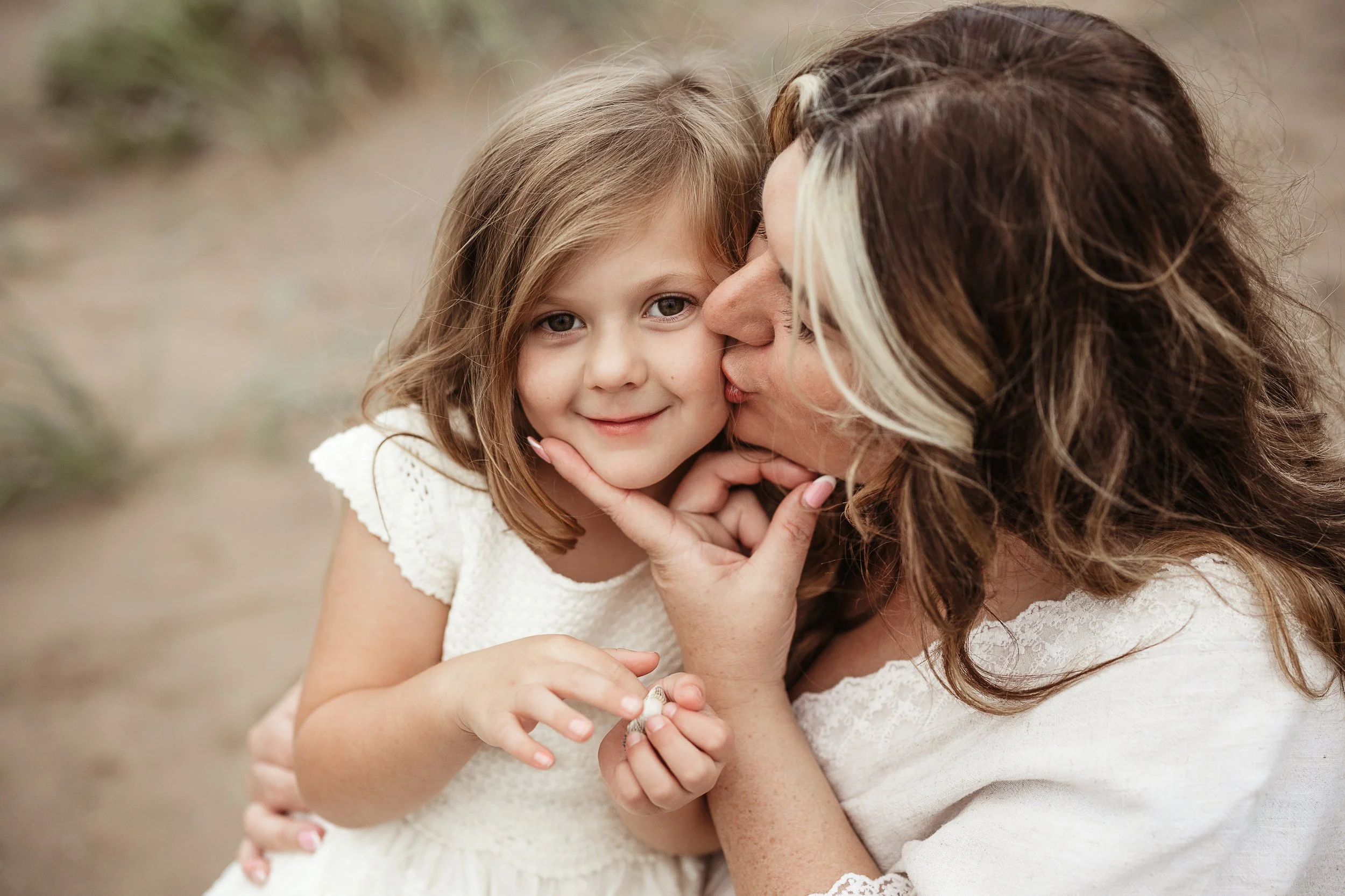 A tender mother and daughter moment, capturing the love, affection and connection between them.