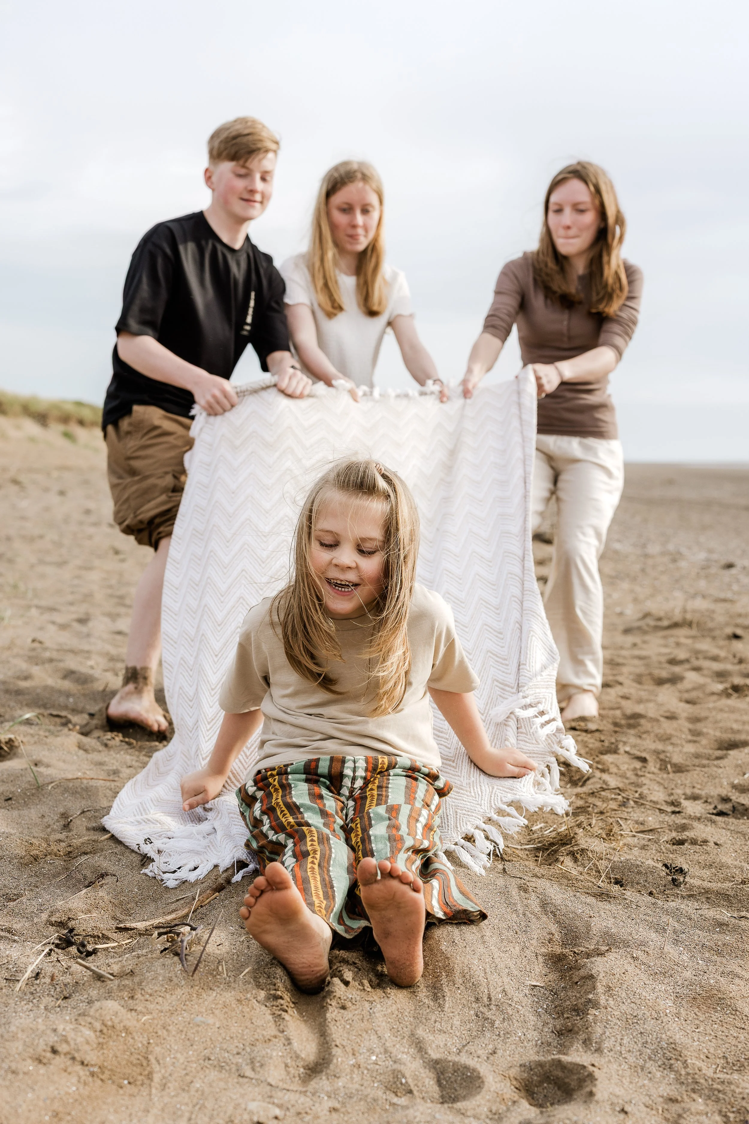 Children playing together on the beach, capturing the freedom, adventure and joy of childhood.