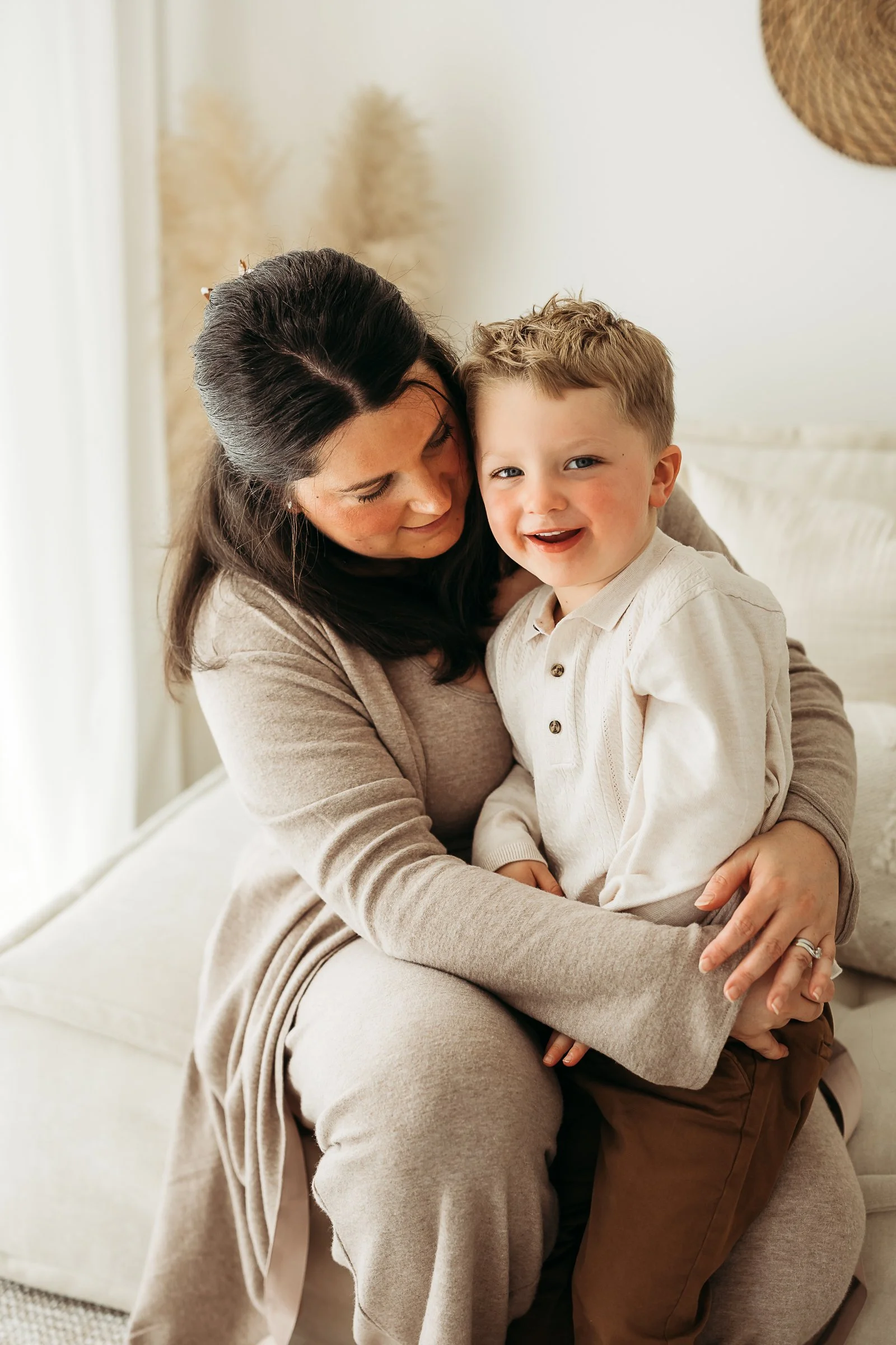 A mother and son sharing a quiet moment together at home, capturing their closeness, love and the everyday connection that matters most.