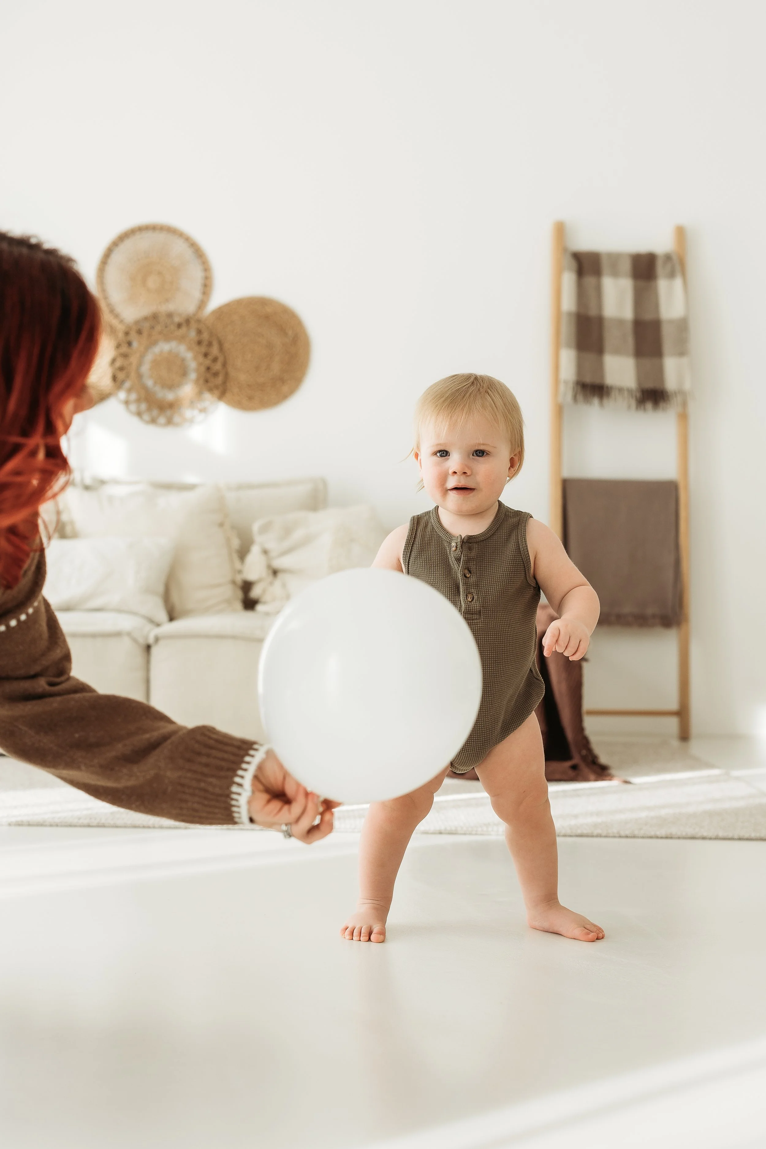 A little one celebrating their first birthday milestone, surrounded by love, warmth and the simple details of this special season.
